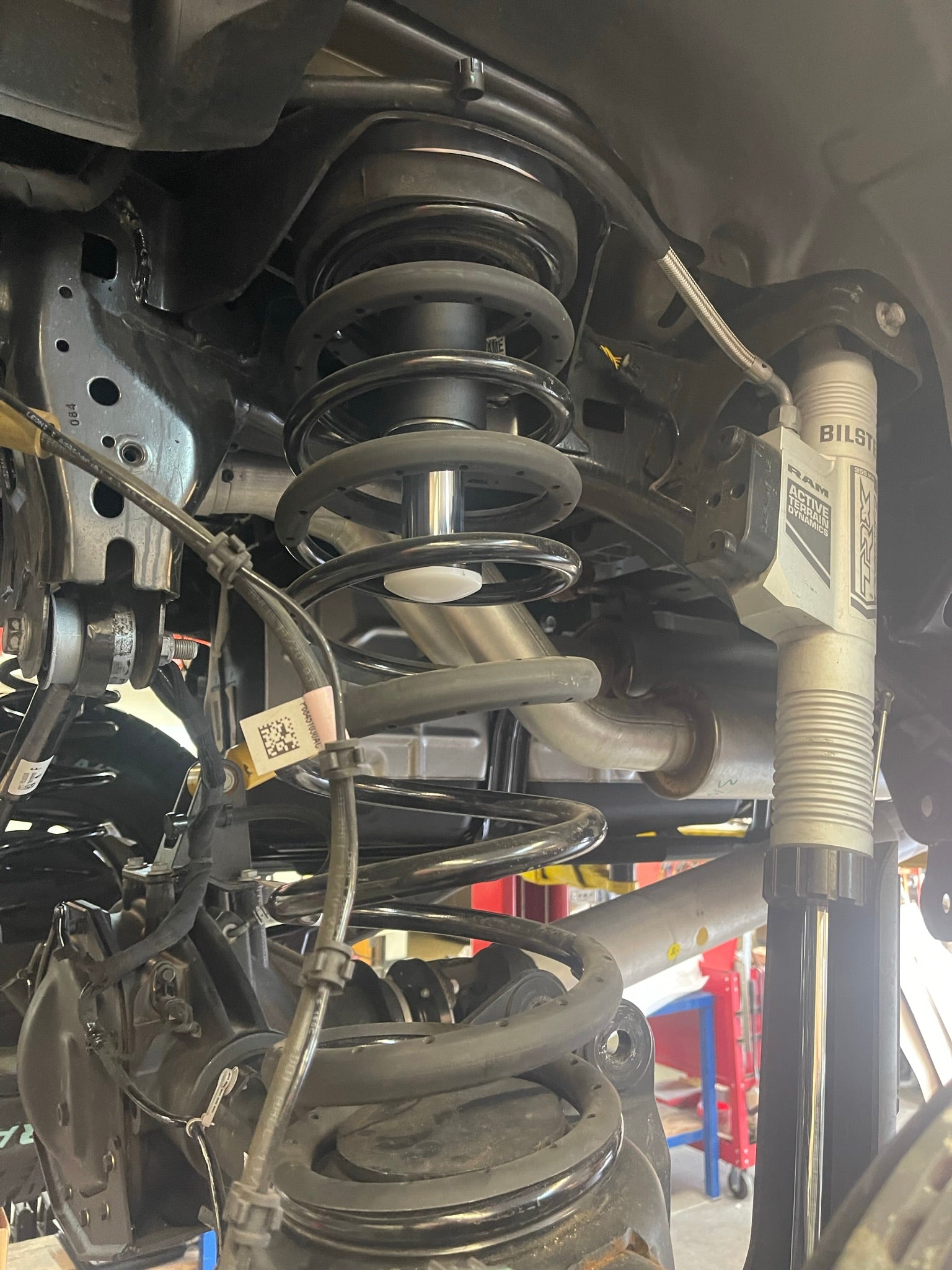 2021 and up Ram TRX rear bump stop kit featuring hydraulic bump stops by Foutz Motorsports installed in a vehicle.