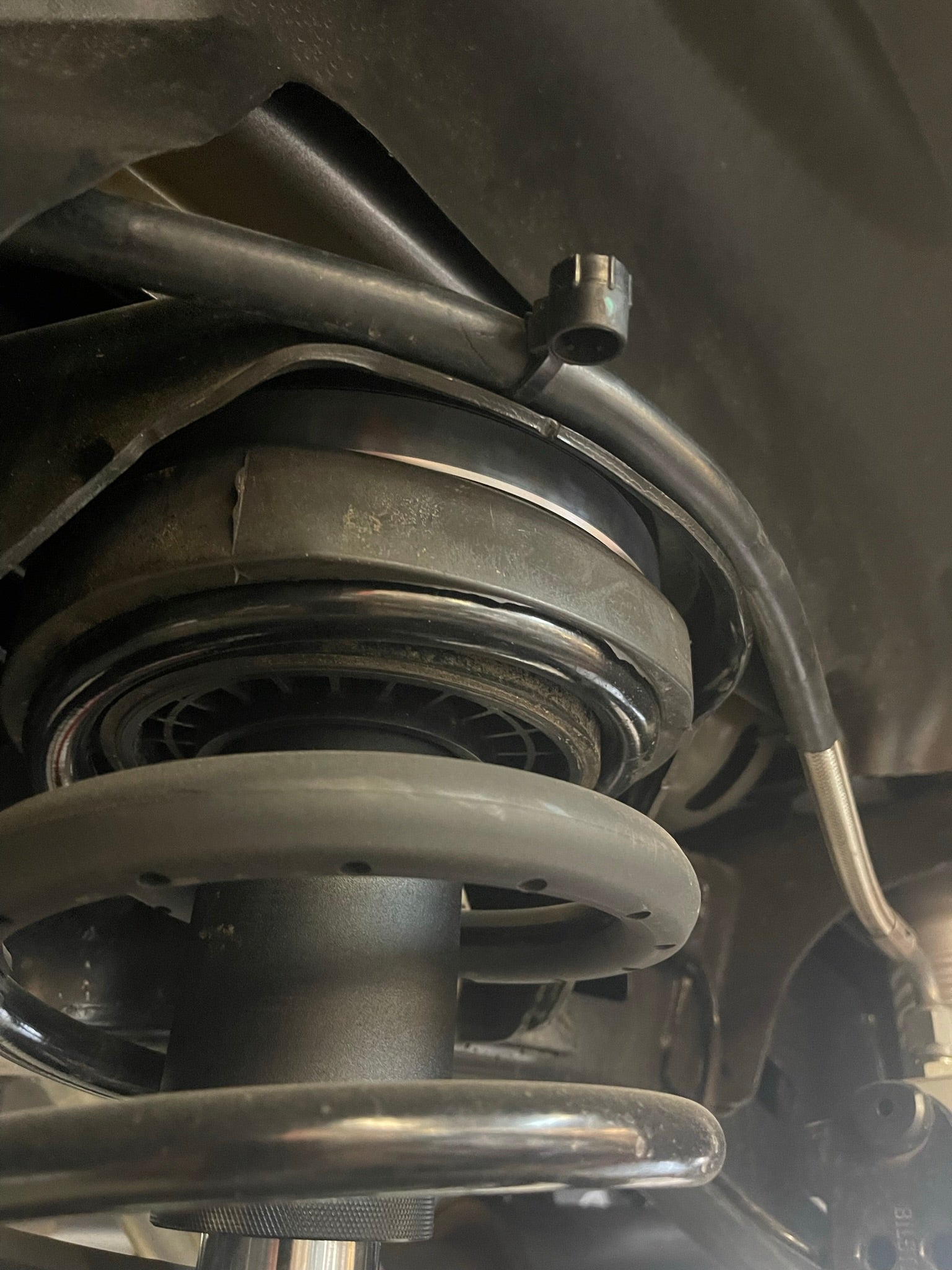2021 and up Ram TRX rear bump stop kit featuring hydraulic bump stops by Foutz Motorsports, showcasing installation details.