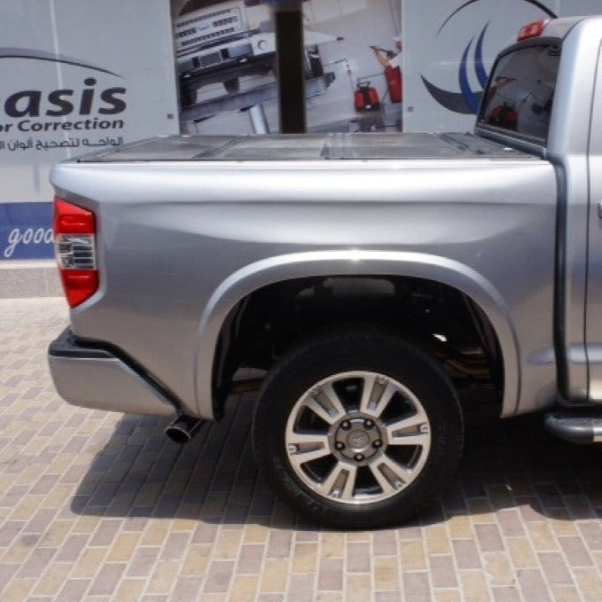 2014-2021 Toyota Tundra showcasing custom bedsides, highlighting a sleek silver exterior and modern wheel design.