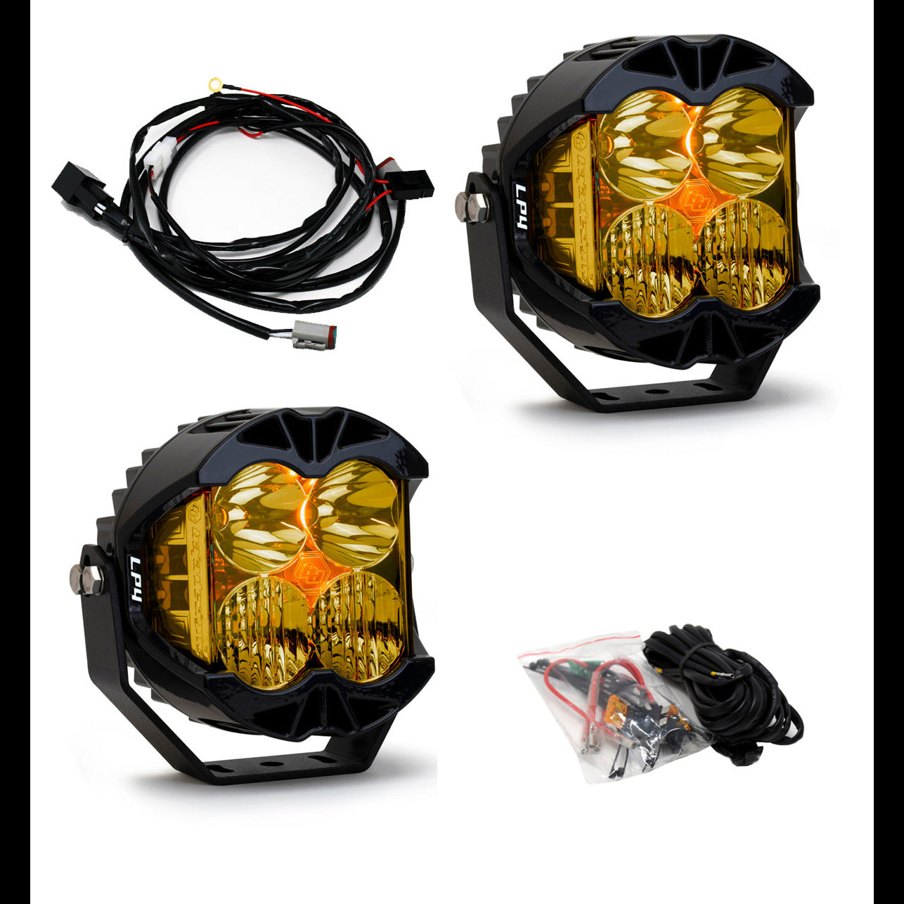 Baja Designs LP4 Pro LED light pair with yellow lenses and wiring harness for enhanced off-road visibility.