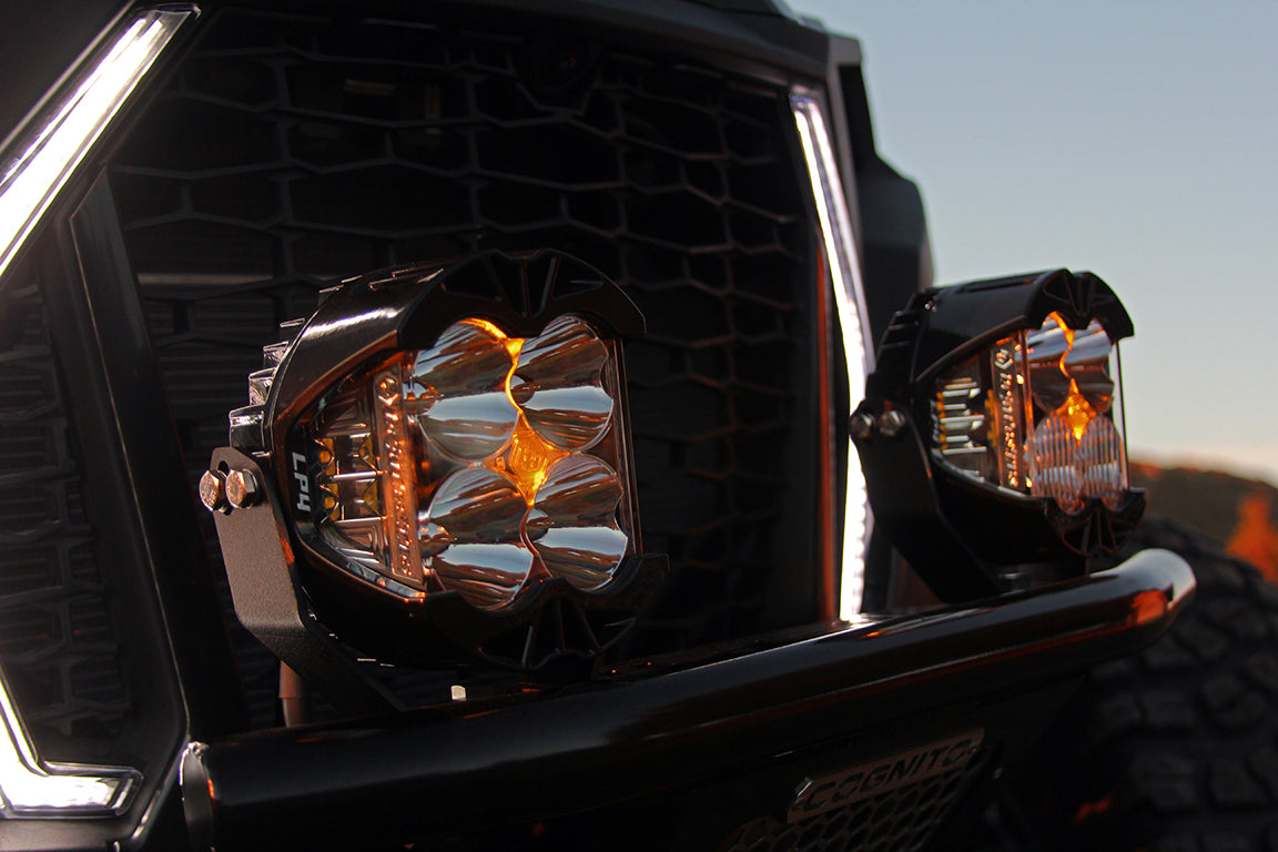 Baja Designs LP4 Pro LED driving lights mounted on a vehicle, showcasing bright illumination and rugged design.