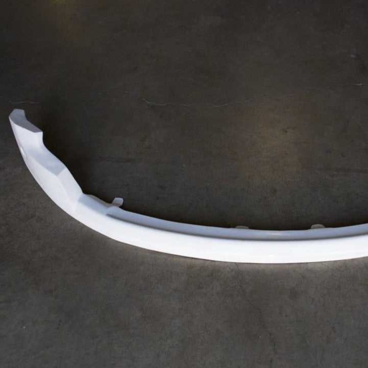 2010-2016 Ford Raptor valance in white, designed for enhanced aerodynamics and style. Ideal for offroad enthusiasts.