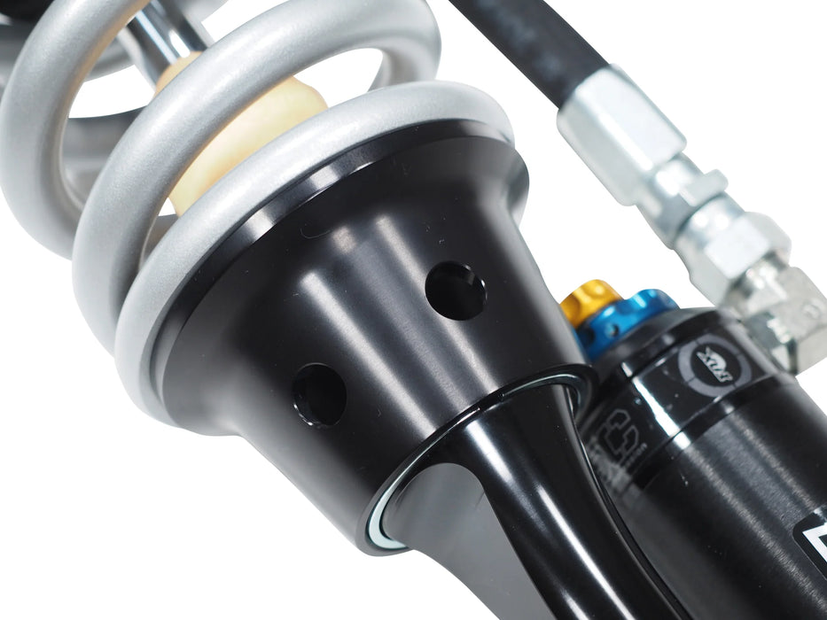 2010-14 Ford Raptor SVT FOX Factory Series Shock Package featuring a close-up of the shock's coil spring and reservoir.
