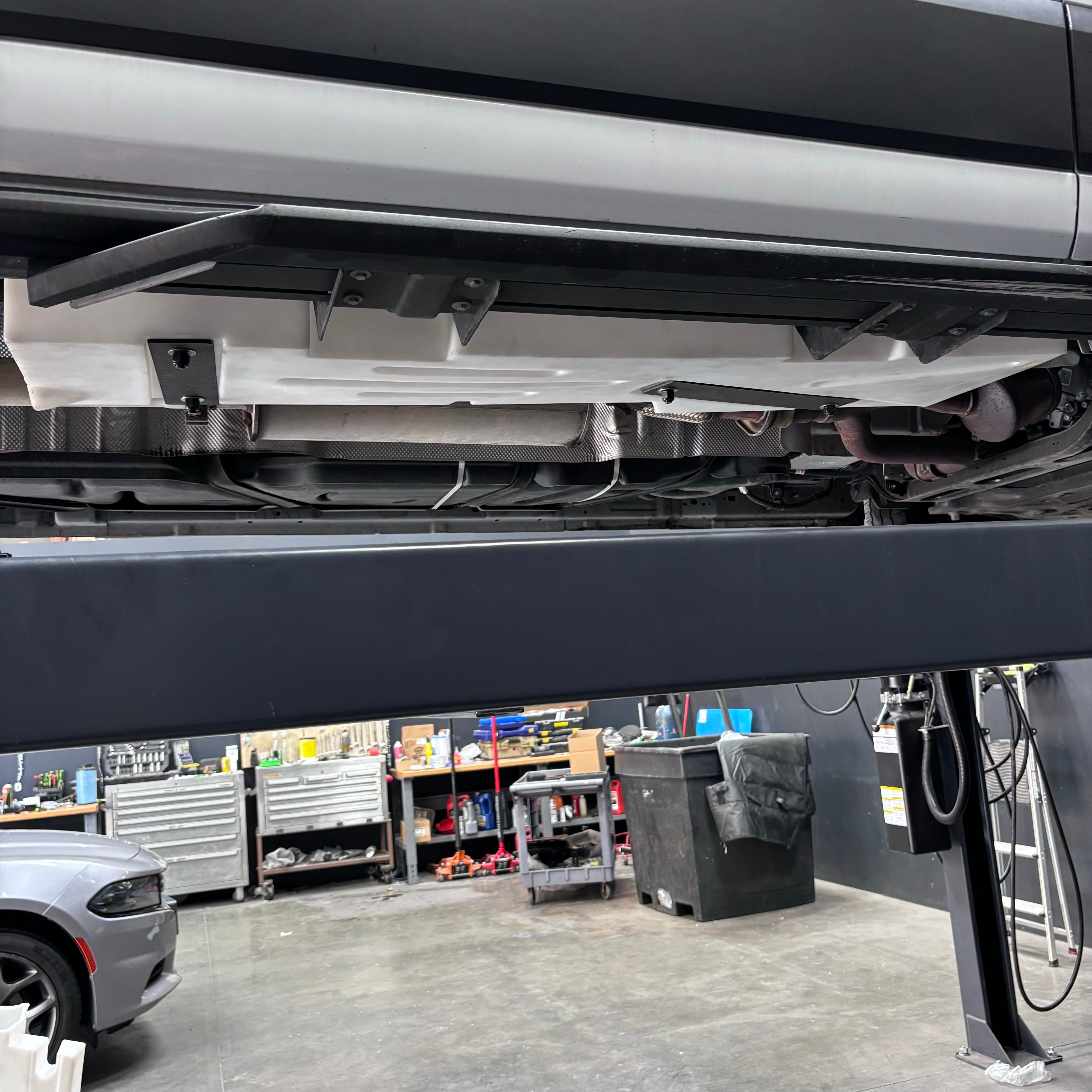20-gallon undercarriage fresh/grey water tank installed on a Ford Transit, showcasing its secure placement and compatibility.