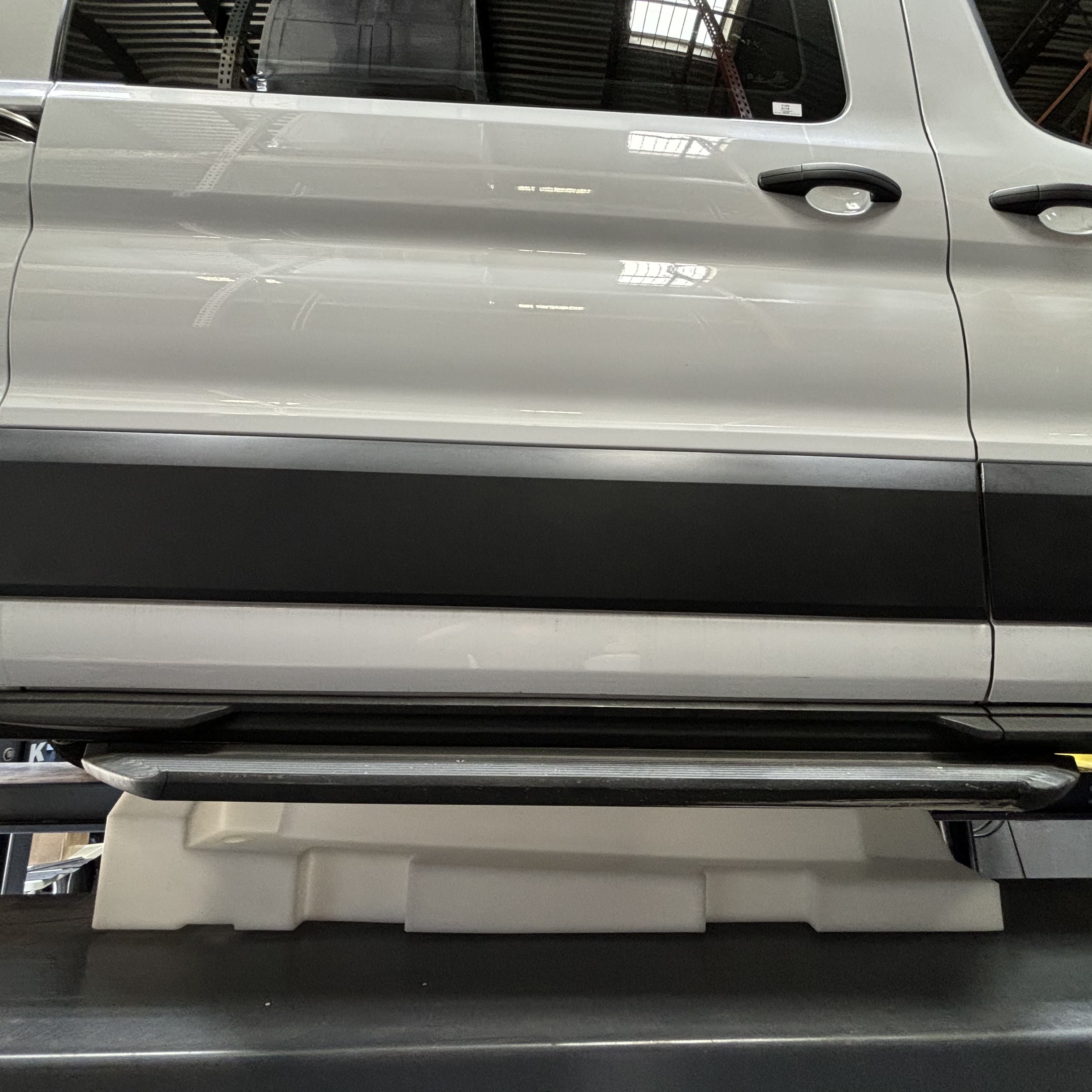 20-gallon undercarriage fresh/grey water tank installed on a 2015-2025 Ford Transit for enhanced utility.