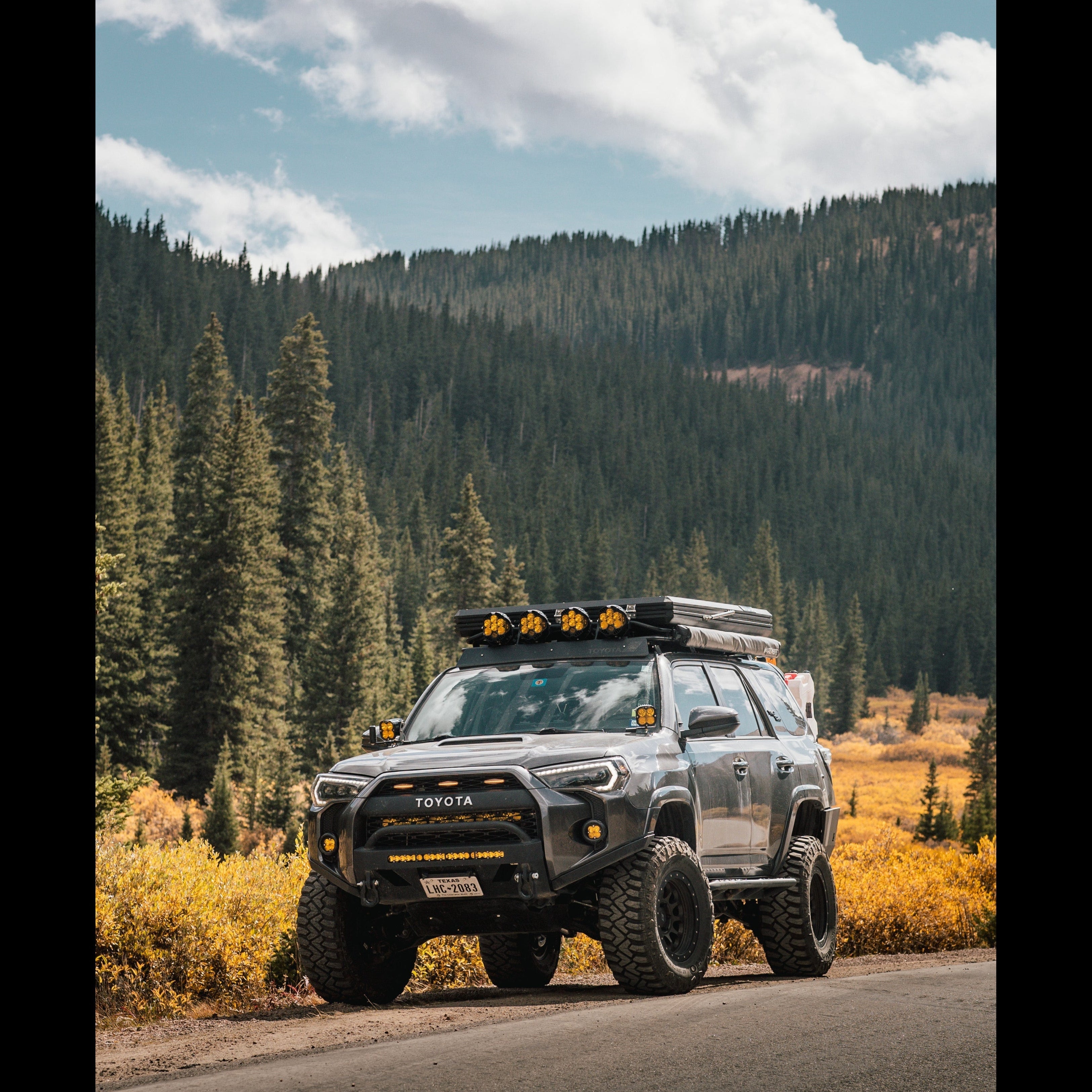 4Runner Lo Pro Bumper with high clearance additions on a 5th Gen Toyota 4Runner, showcasing offroad capability in a scenic landscape.