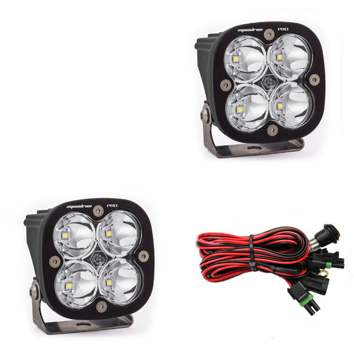 Baja Designs Squadron Pro LED cubes with four LEDs each, paired with wiring harness for offroad lighting solutions.