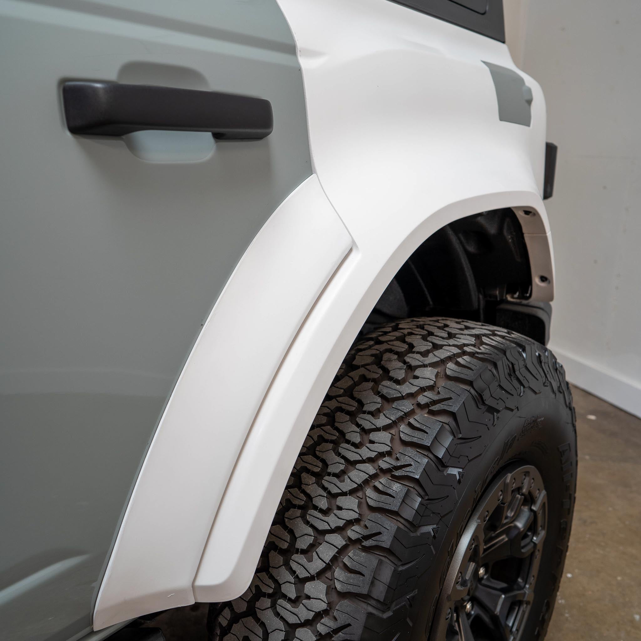 2022-2025 Ford Bronco Raptor rear quarter kit showcasing a sleek design and rugged tire compatibility for offroad performance.