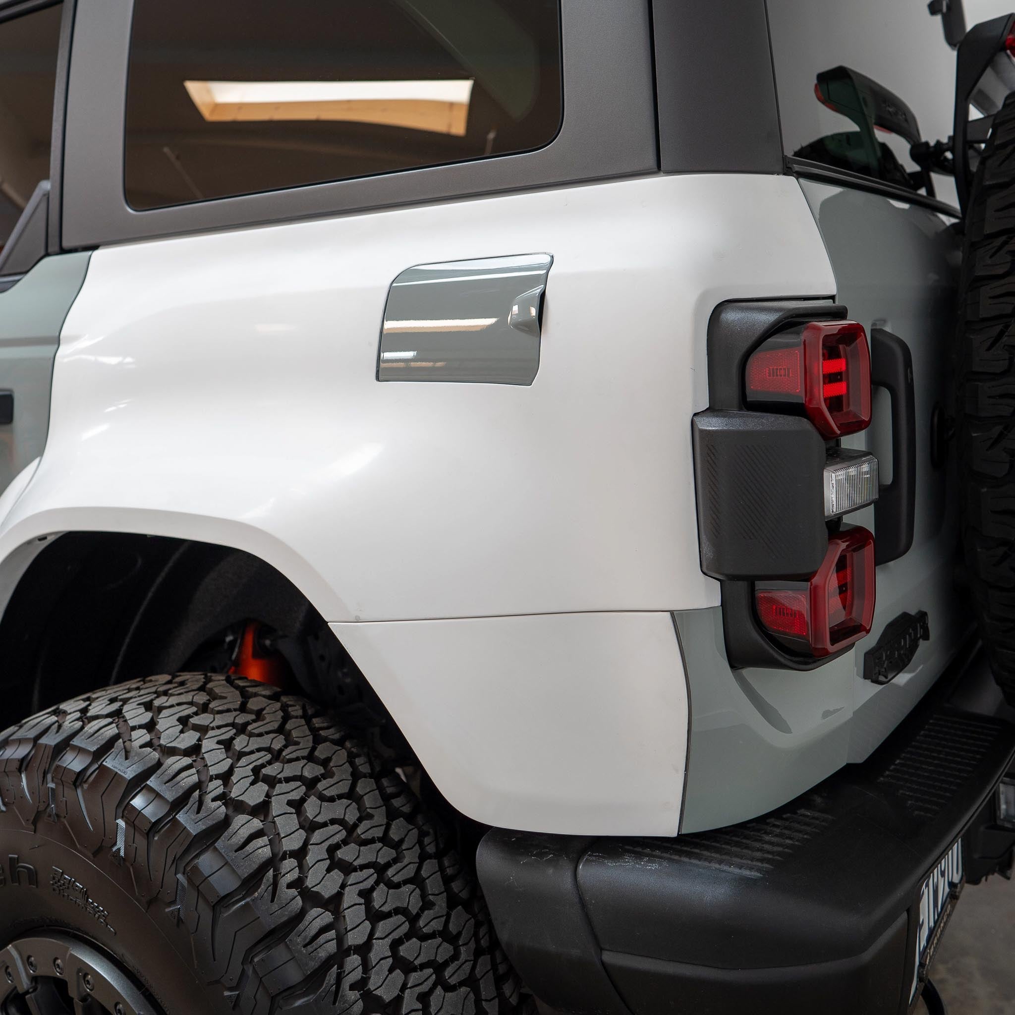 Rear quarter kit for 2022-2025 Ford Bronco Raptor showcasing sleek design and rugged tire fitment.