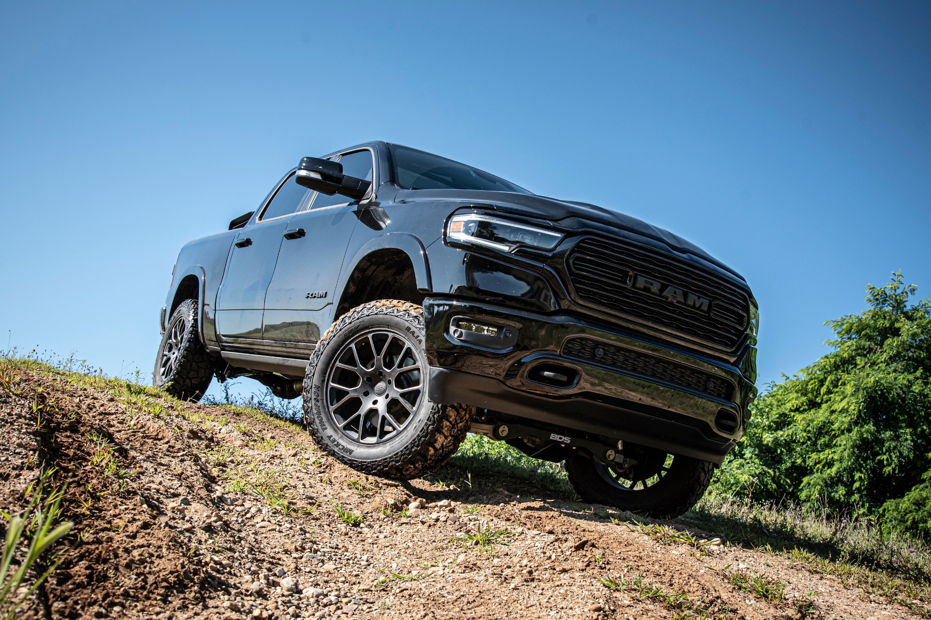 4-inch lift kit installed on a Ram 1500 with air ride, showcasing enhanced off-road capability and rugged design.