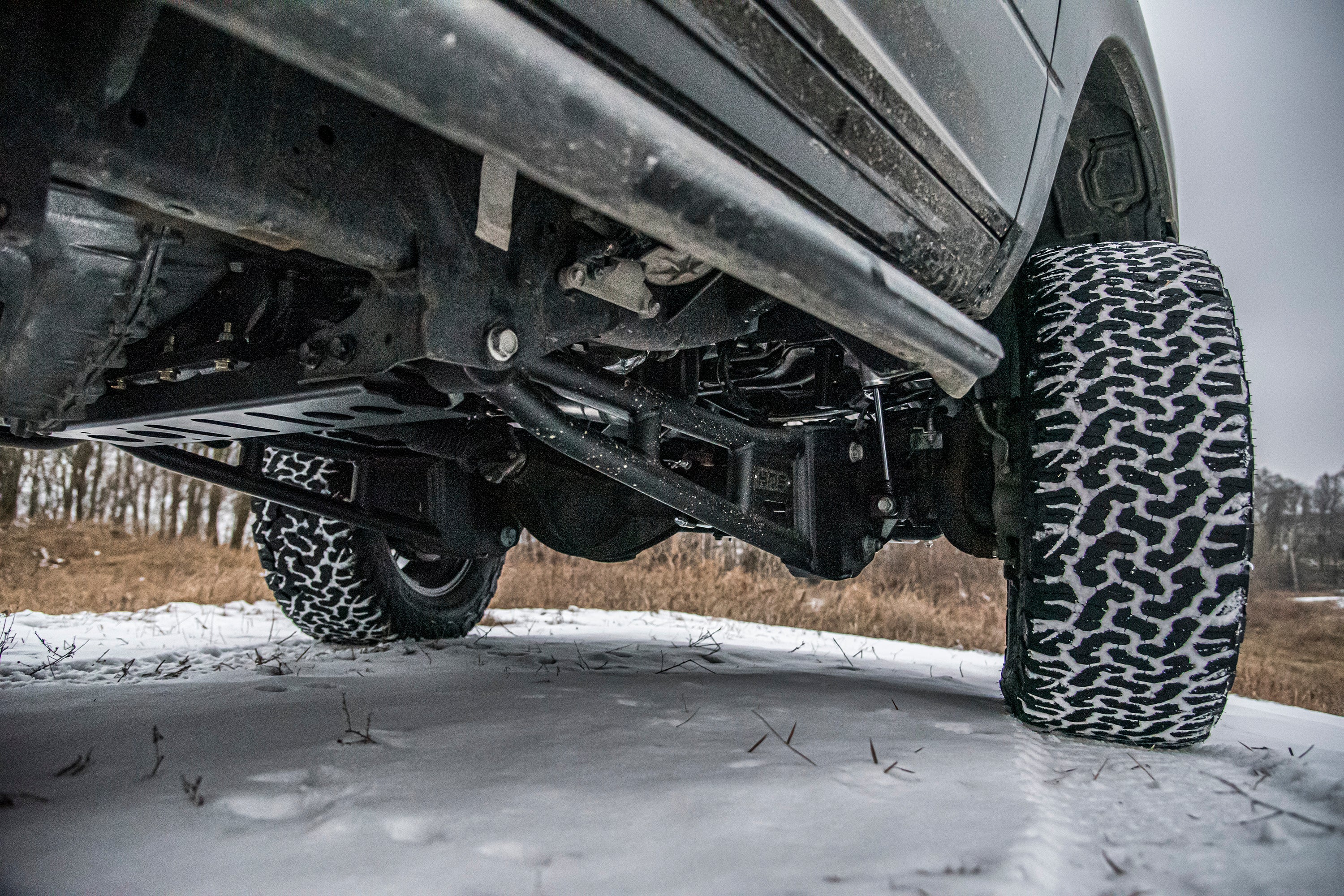 4 inch lift kit installed on a Ram 2500 with rear air ride, showcasing enhanced suspension and rugged tires on snow.