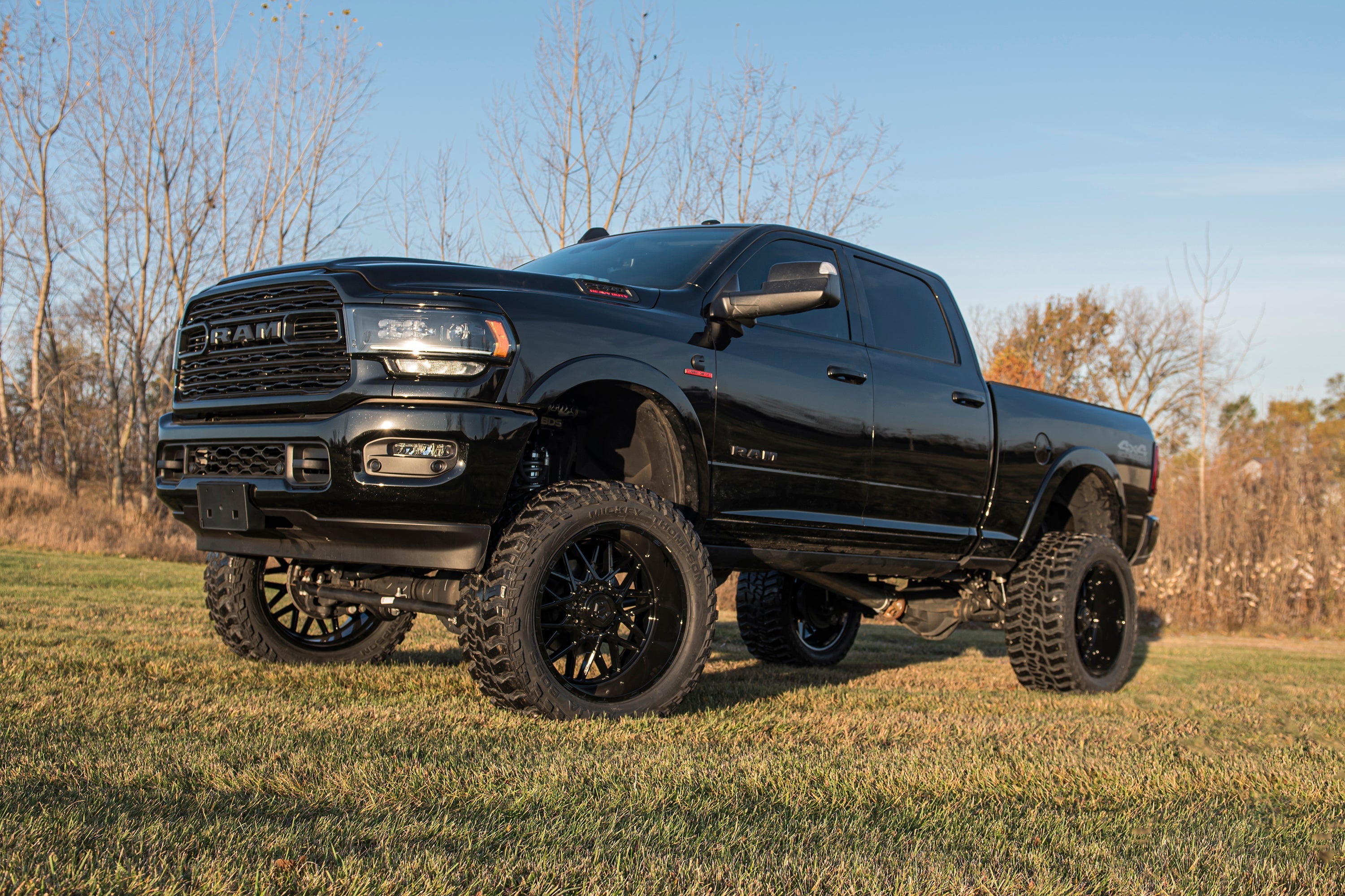 8-inch lift kit with 4-link for 2019-2024 Ram 3500 4WD diesel, showcasing enhanced off-road capability and aggressive stance.