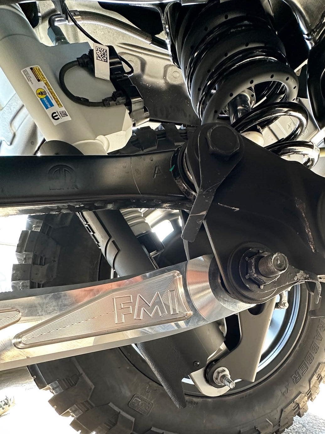2025 Ram RHO rear lower suspension arms made of billet aluminum, showcasing durable construction and off-road capability.