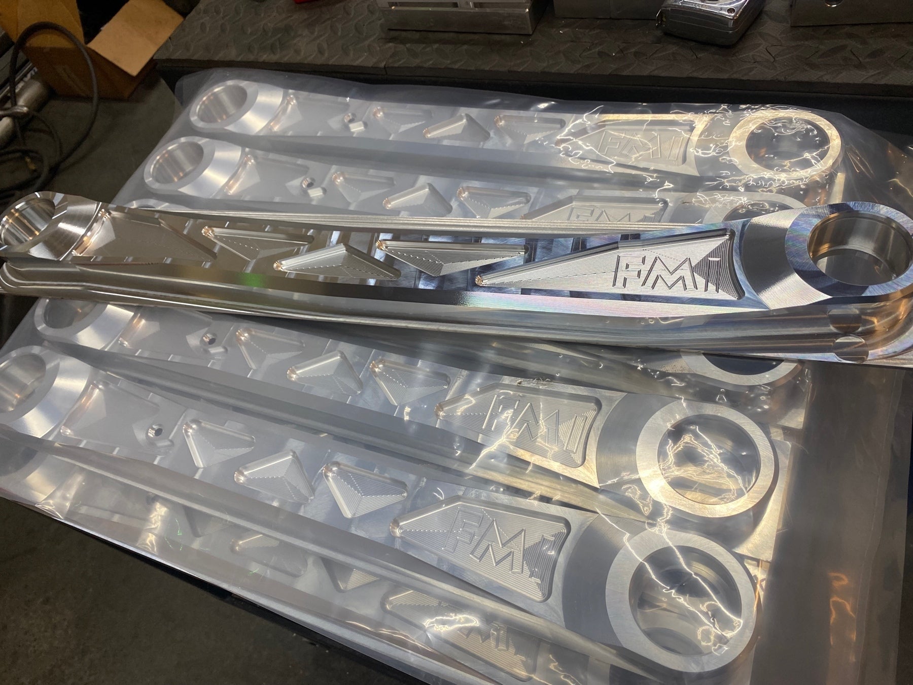 Billet aluminum rear lower suspension arms for the 2025 Ram RHO, showcasing precision engineering and durability.