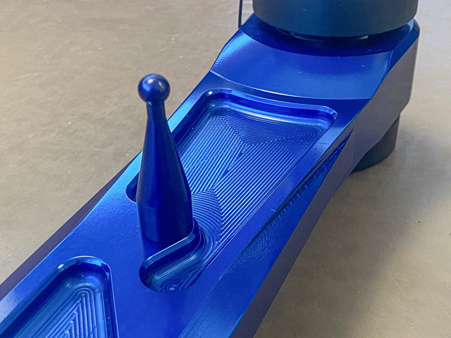 2025 Ram RHO rear suspension arm kit made of billet aluminum, featuring a sleek blue finish and precision engineering details.