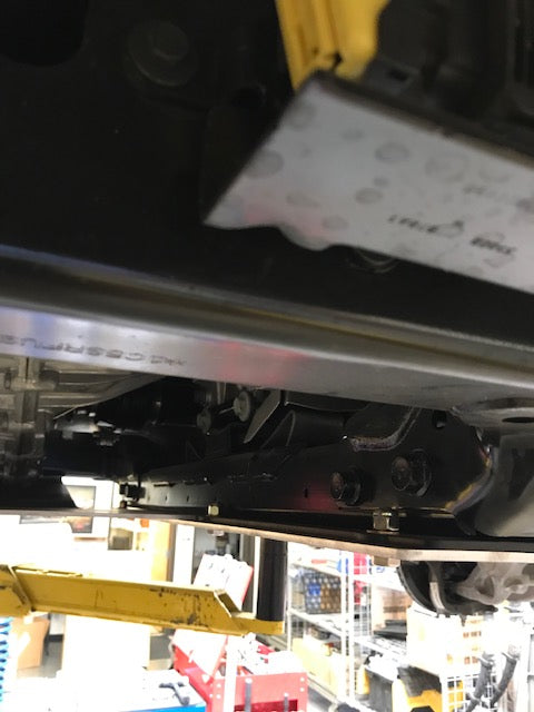 Underbody view of a 2021-2024 Ram TRX skid plate kit showcasing durable protection and installation details.