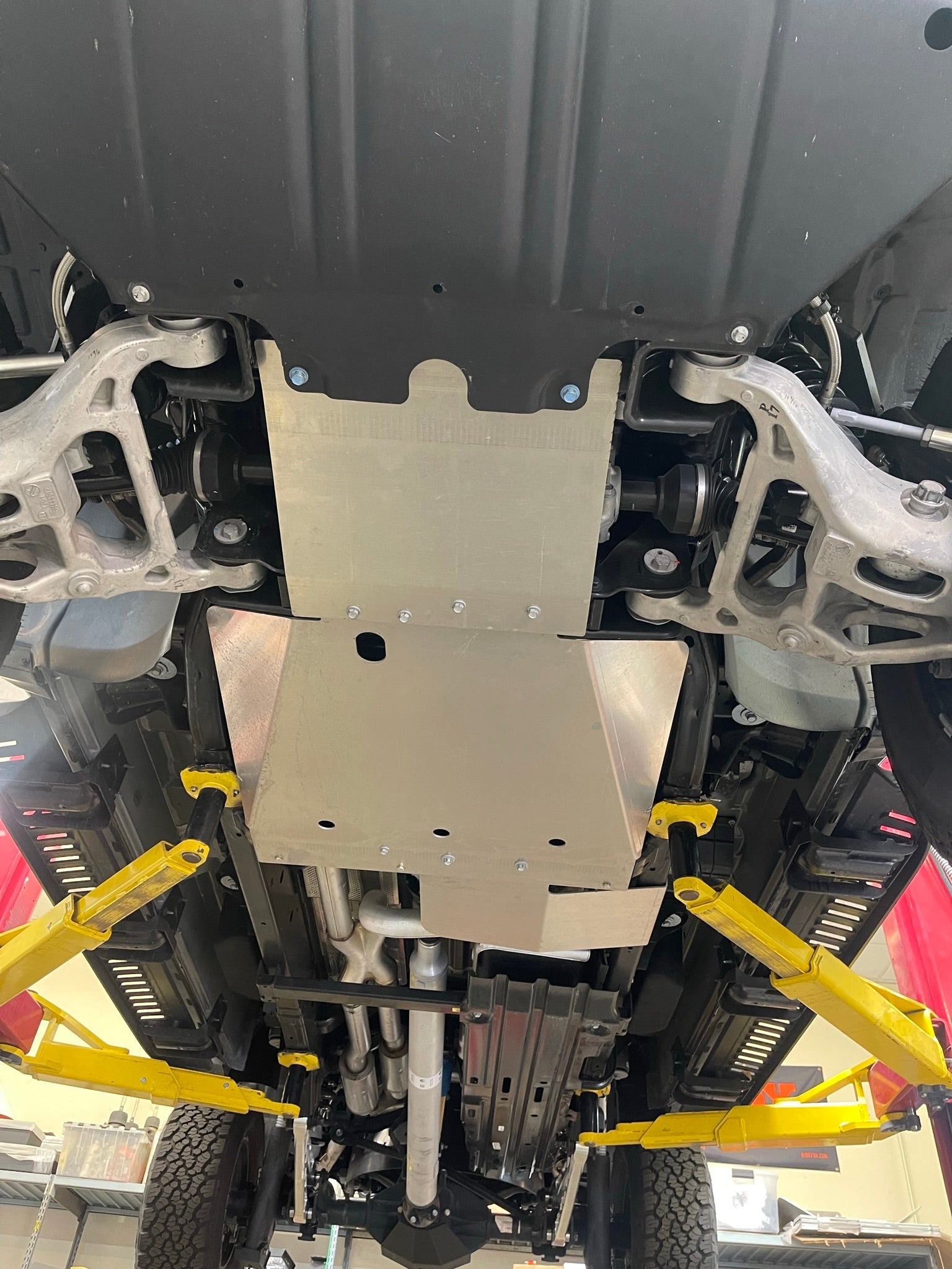 2021-2024 Ram TRX skid plate kit installed under the vehicle, showcasing protection for the underbody components.