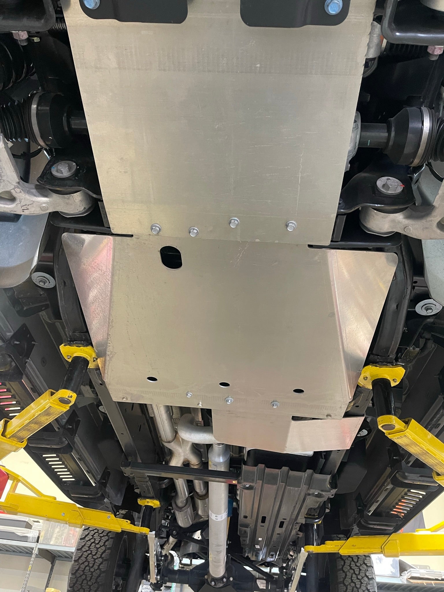 2021-2024 Ram TRX skid plate kit installed under the vehicle, showcasing durable aluminum protection for the underbody.