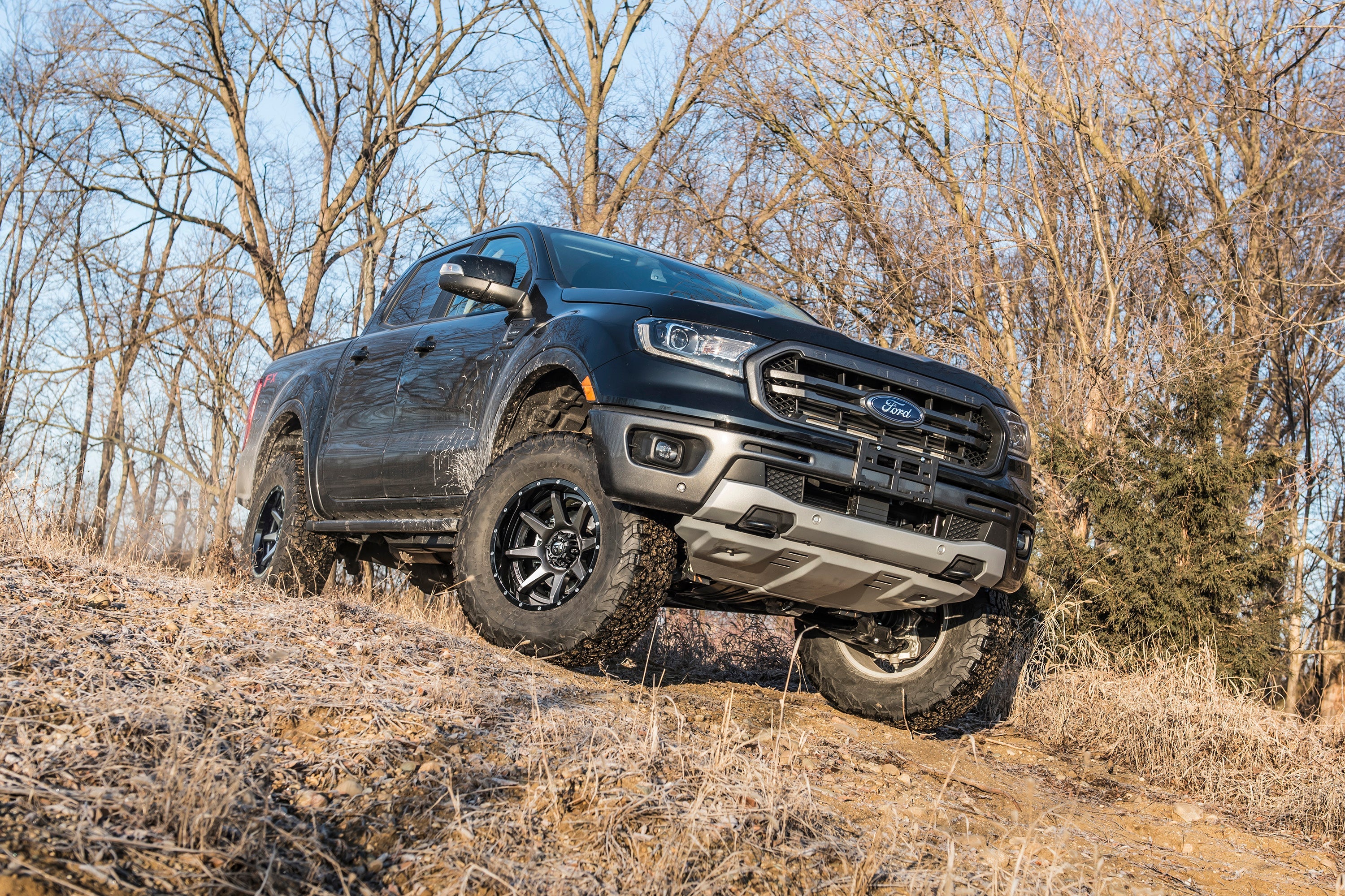 3.5 inch lift kit with FOX 2.0 coil-over installed on a Ford Ranger 4WD, showcasing off-road capability in rugged terrain.