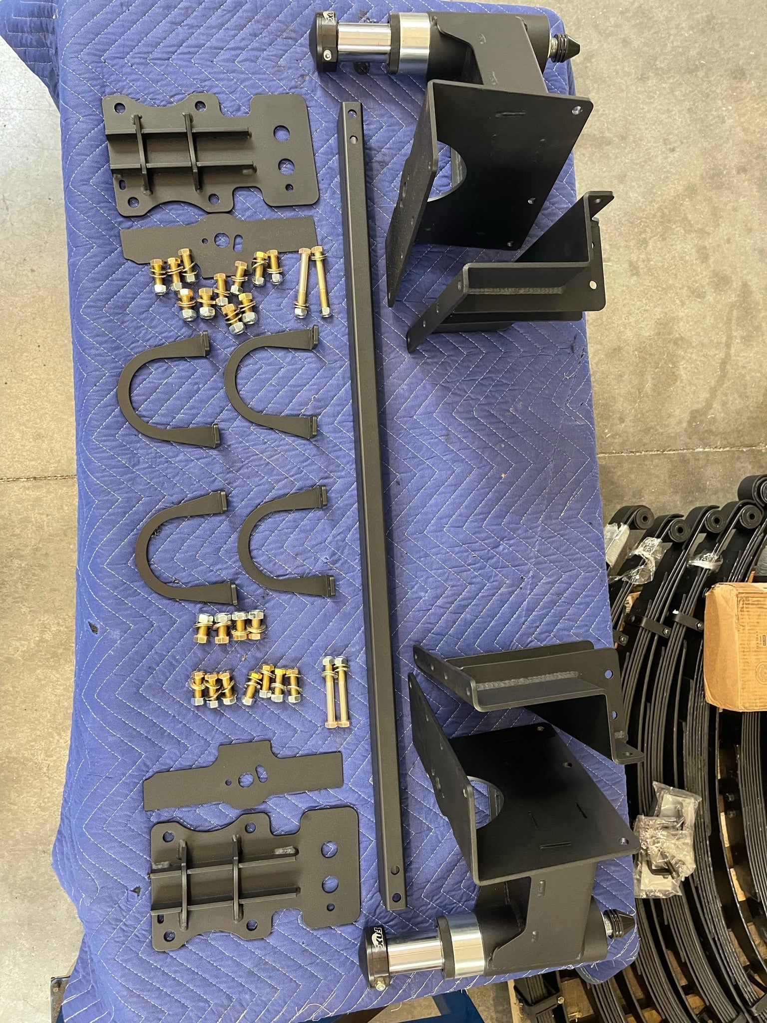 Rear bump stop kit for 2017-2020 Raptor and 2015-2024 F150, including brackets, bump stops, and installation hardware.