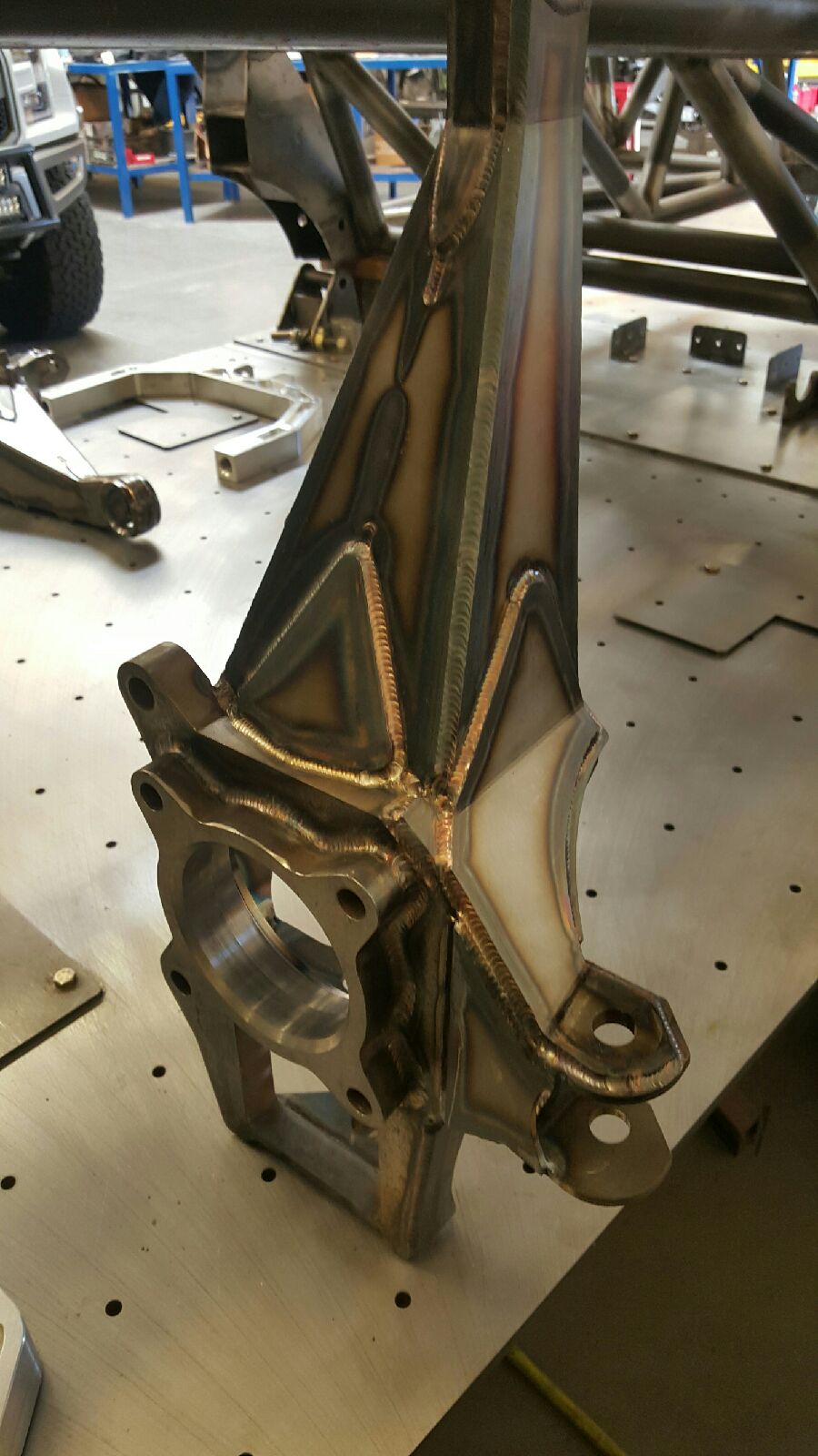 2017 Up Raptor Long Travel Front Suspension Kit - Gen 2, showcasing a detailed metal suspension component with welds.
