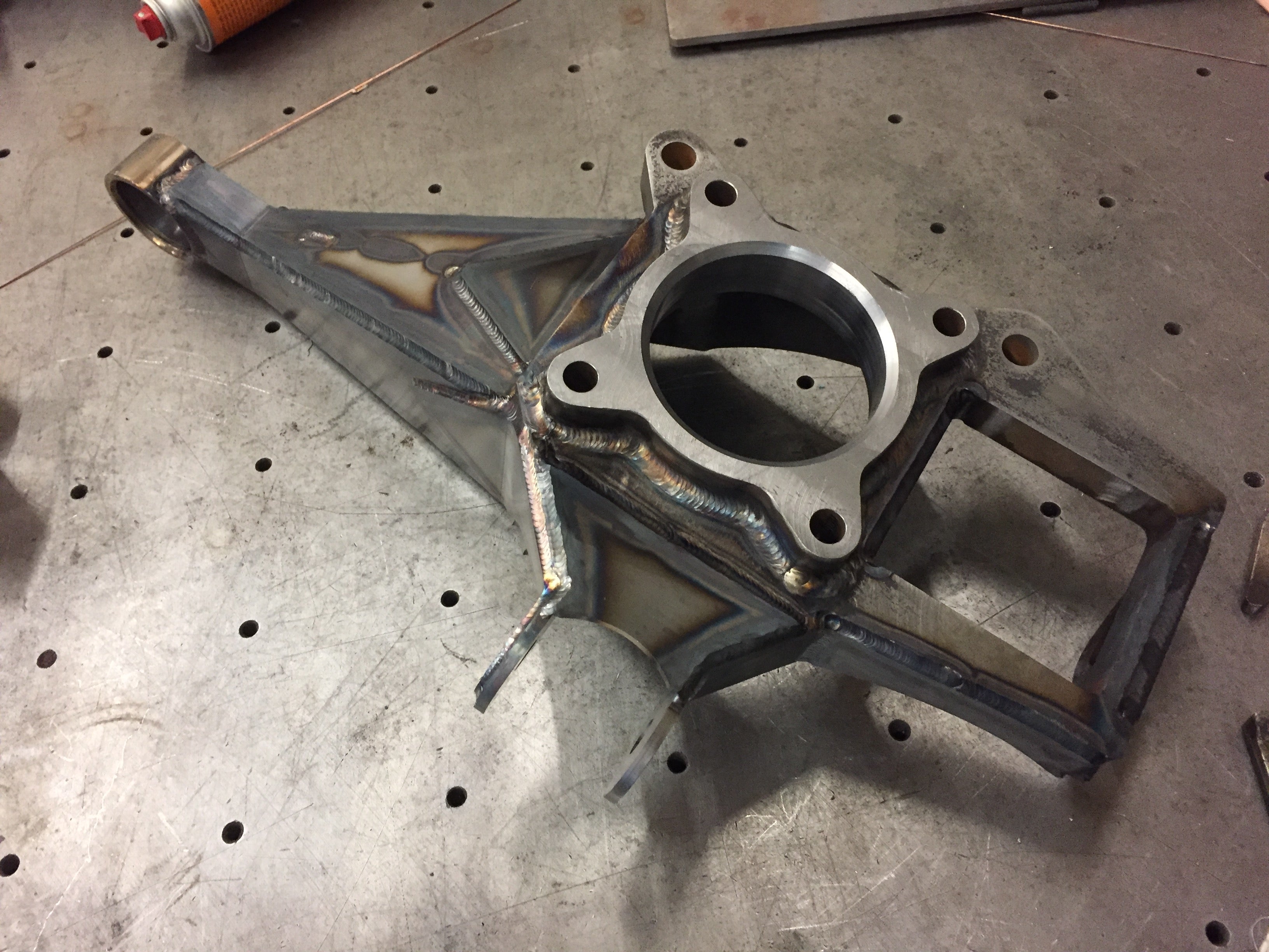 2017 Up Raptor Long Travel Front Suspension Kit showing a custom metal suspension component with welded joints.