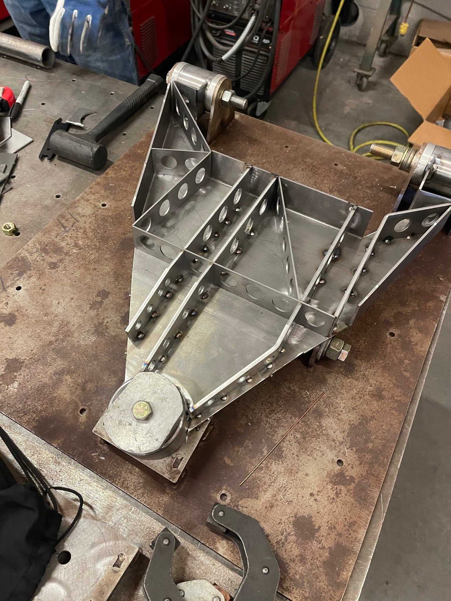 2017 Up Raptor Long Travel Front Suspension Kit showcasing a robust metal frame with intricate design and mounting points.