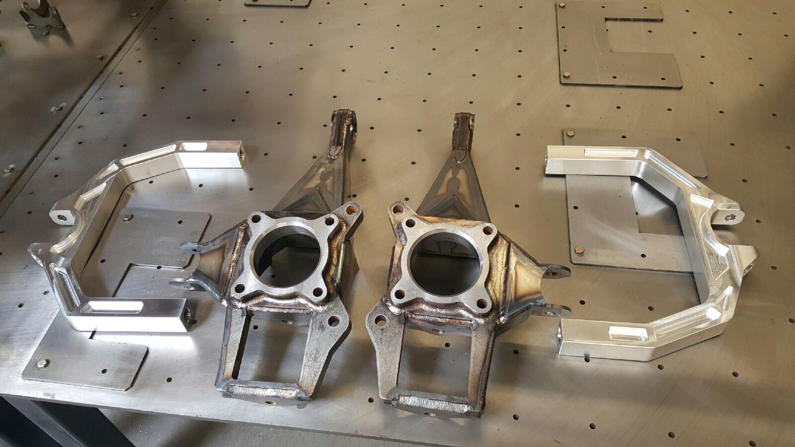 2017 Up Raptor Long Travel Front Suspension Kit showing aluminum and steel components for enhanced offroad performance.