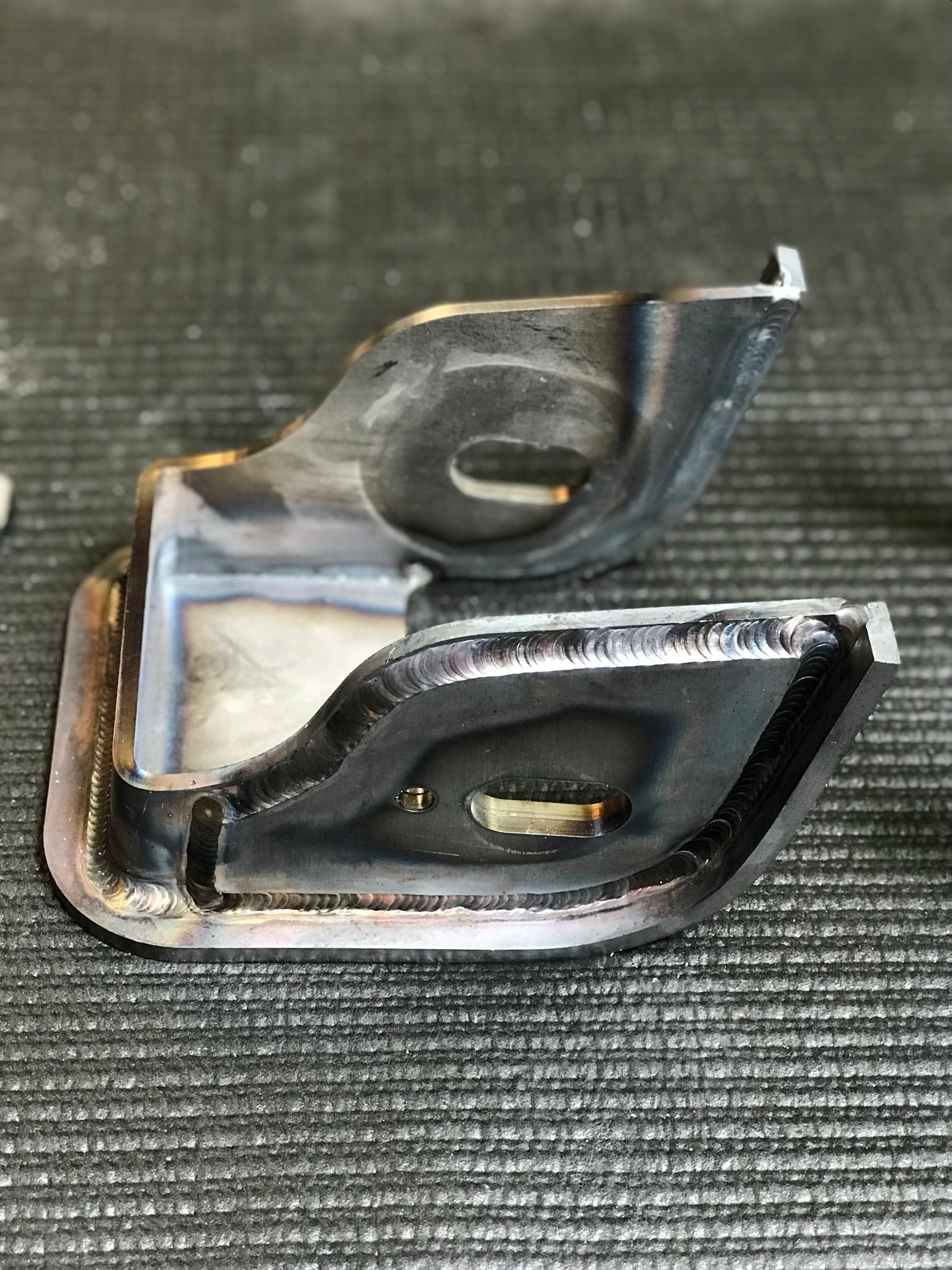 Raptor lower arm pocket replacement kit by Foutz Motorsports, featuring durable welded metal construction for enhanced performance.