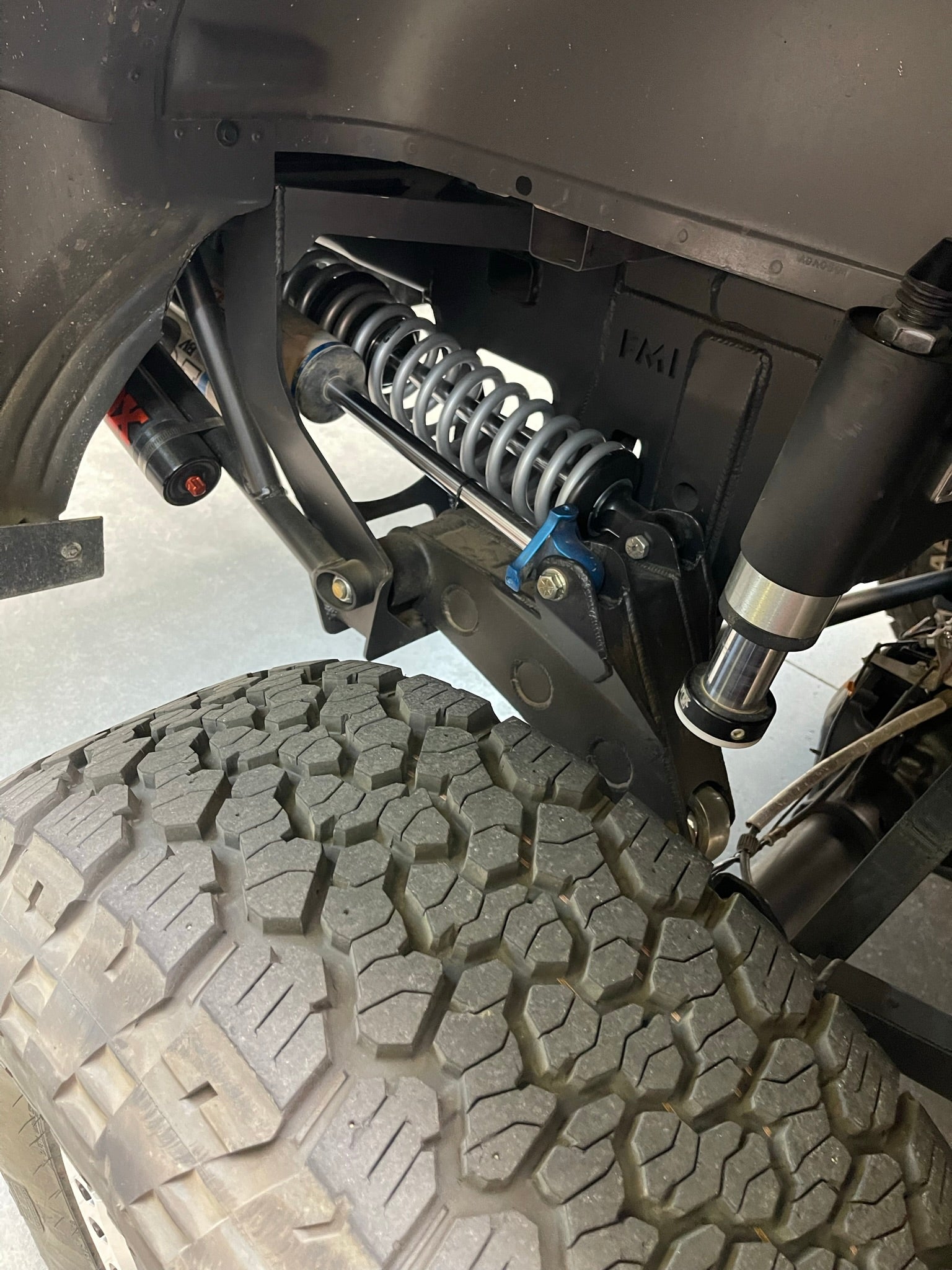 2010-2014 Raptor long travel 5-link rear suspension conversion kit installed on F150, showcasing 19 inches of travel.