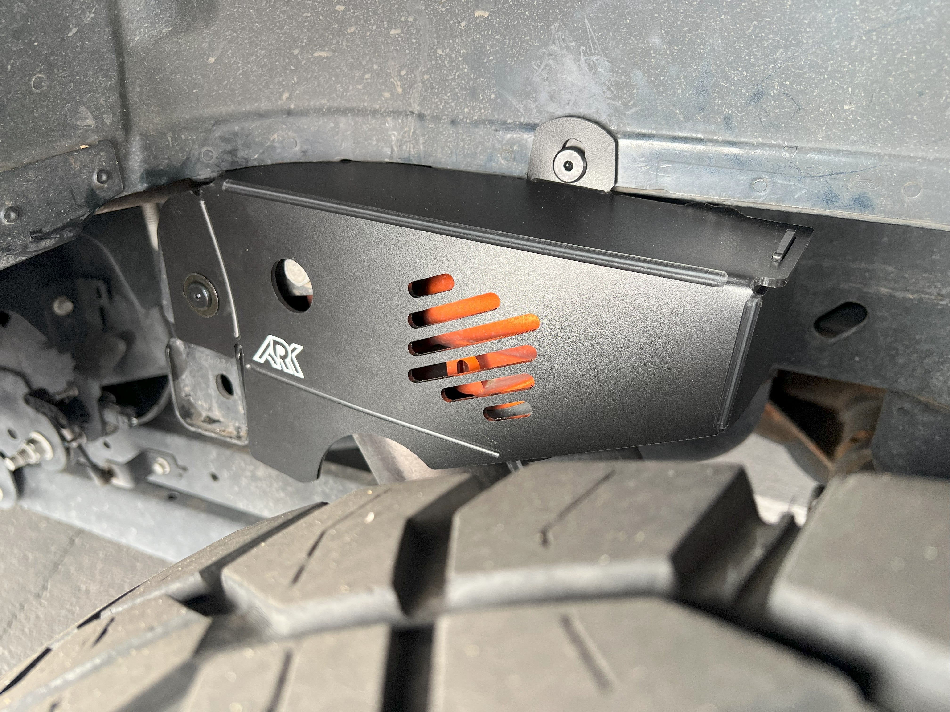 2021+ Ford Raptor strut protection panel showcasing durable design and precise fit for enhanced offroad performance.