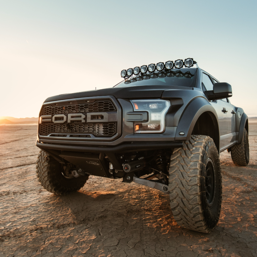 2017-2020 Ford Raptor fenders showcasing rugged design and off-road capability on a desert landscape.