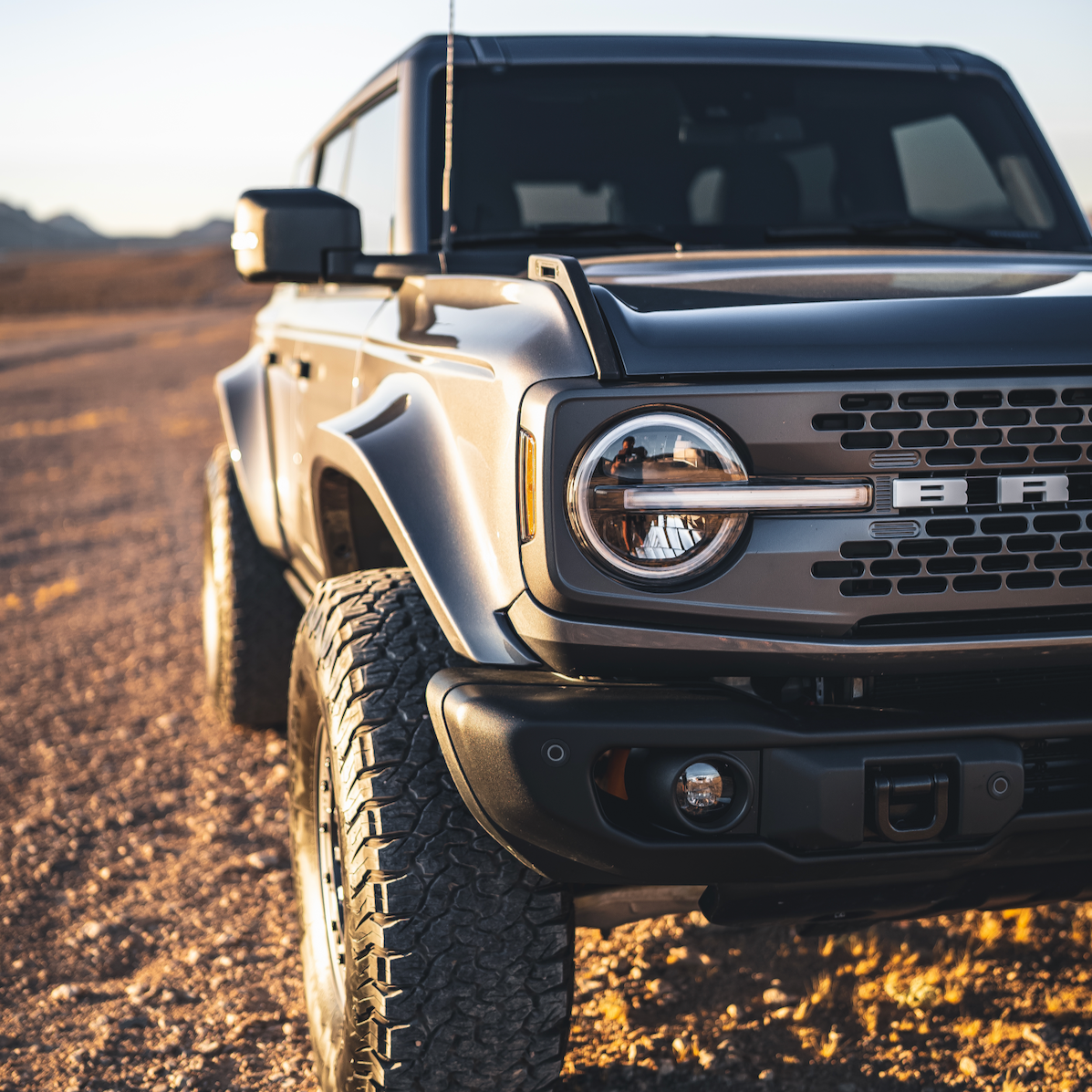 2021-2025 Ford Bronco fenders showcasing rugged design and enhanced off-road capability in a desert setting.