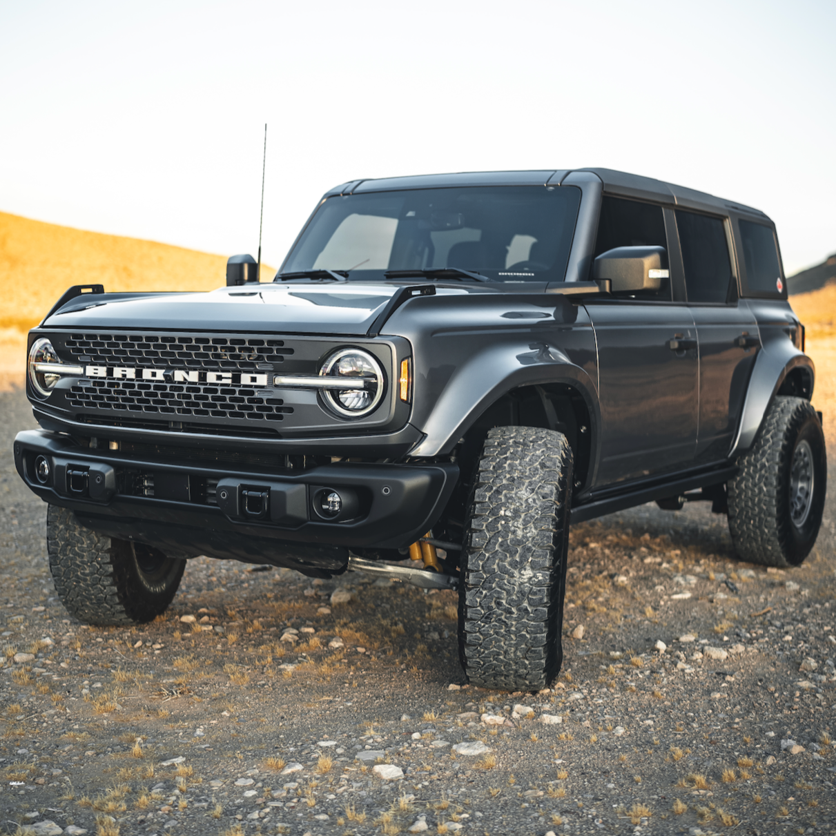 2021-2025 Ford Bronco with aftermarket fenders, showcasing an aggressive offroad design and enhanced tire clearance.