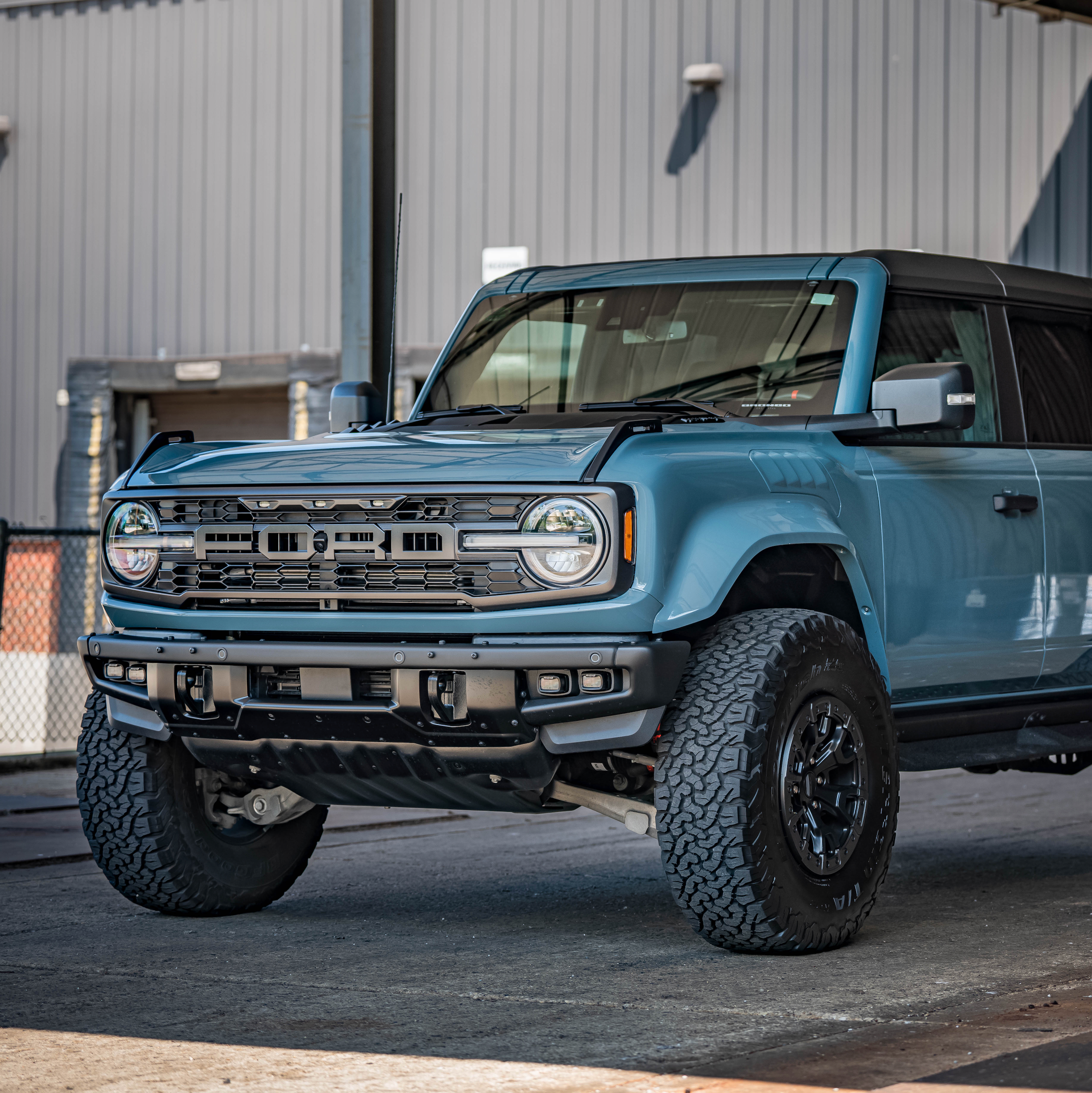 2022-2025 Ford Bronco Raptor with aftermarket fenders showcasing rugged design and off-road capability.