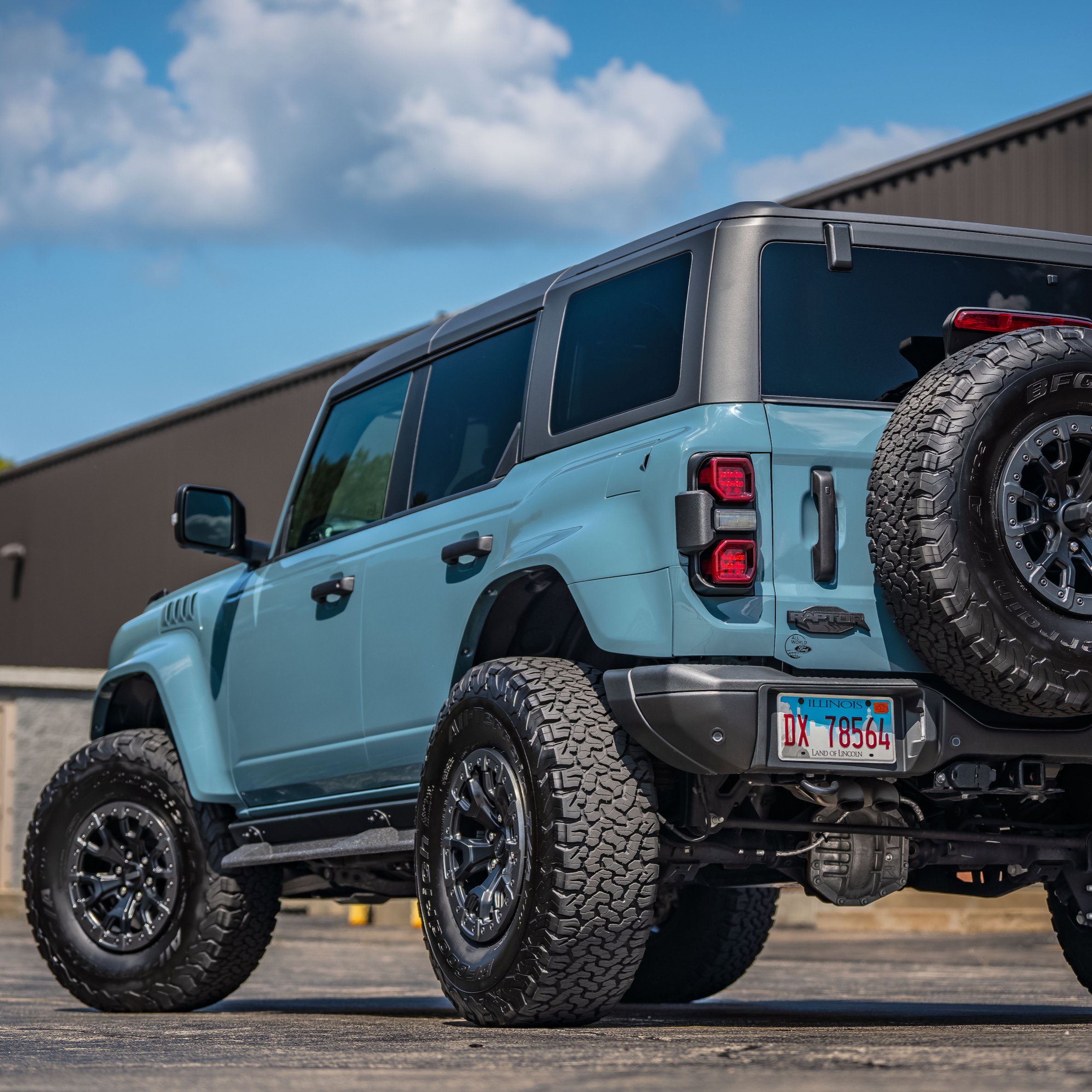 2022-2025 Ford Bronco Raptor showcasing a rear quarter kit with rugged tires and off-road enhancements.