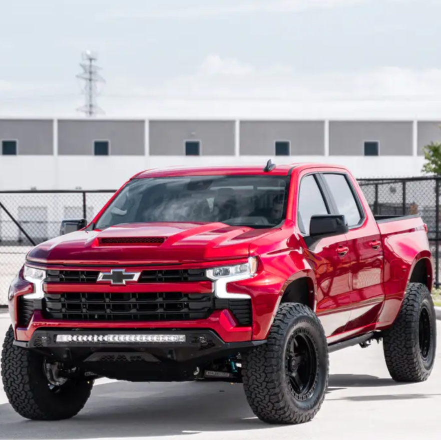 2019-2025 Chevrolet Silverado fenders displayed on a lifted red truck, showcasing rugged design and off-road capability.