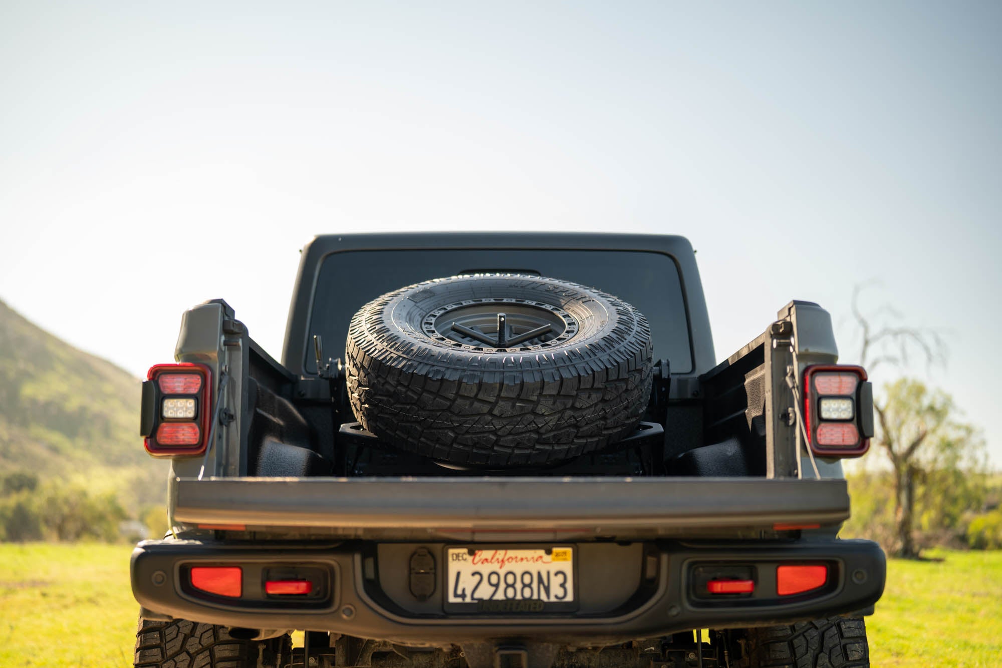 2020 2025 Jeep Gladiator JT Adjustable In Bed Tire Carrier DV8 Offroad