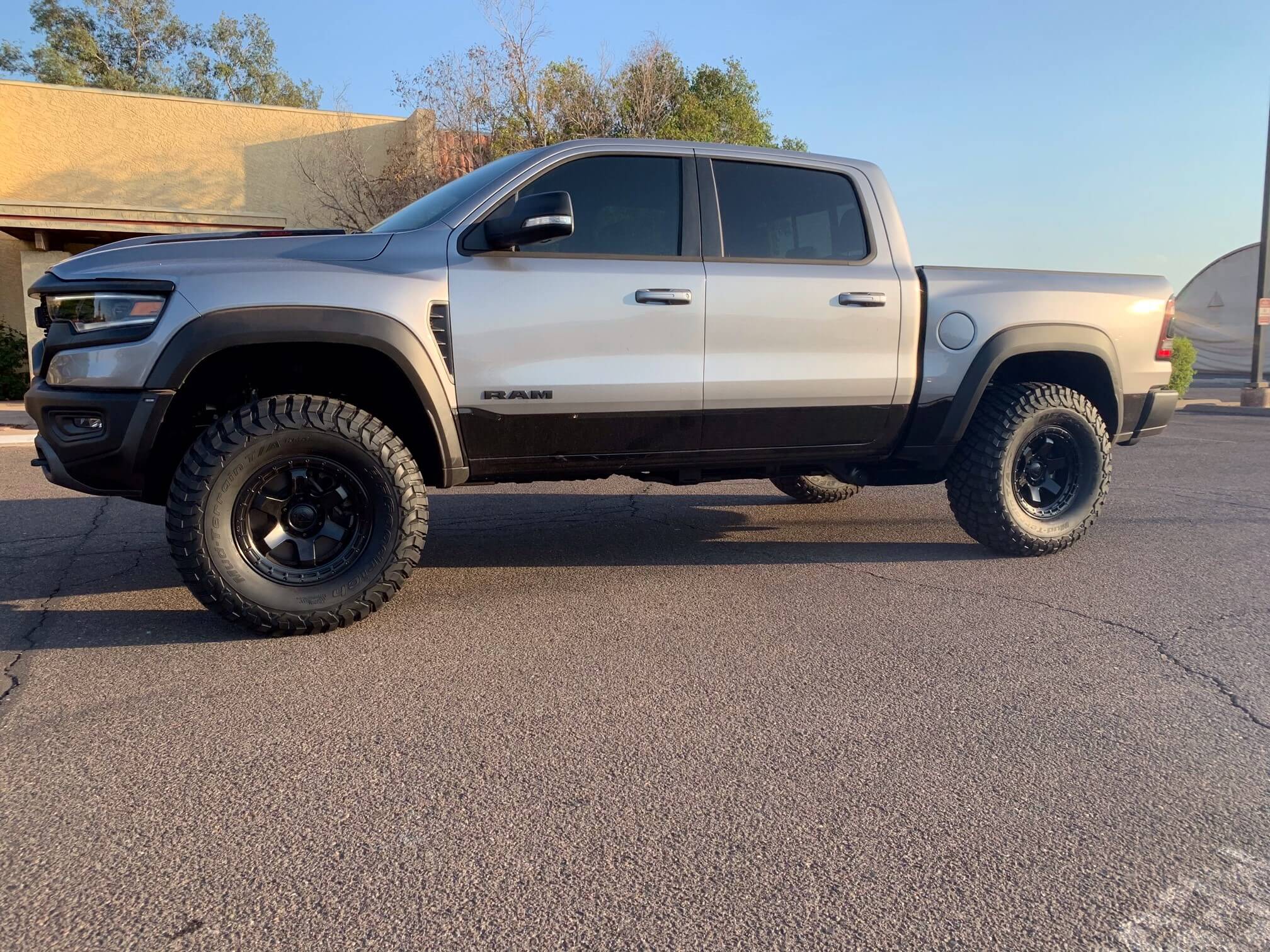 2025 Ram truck with a RHO 1.5 inch front leveling kit, showcasing enhanced stance and rugged offroad tires.