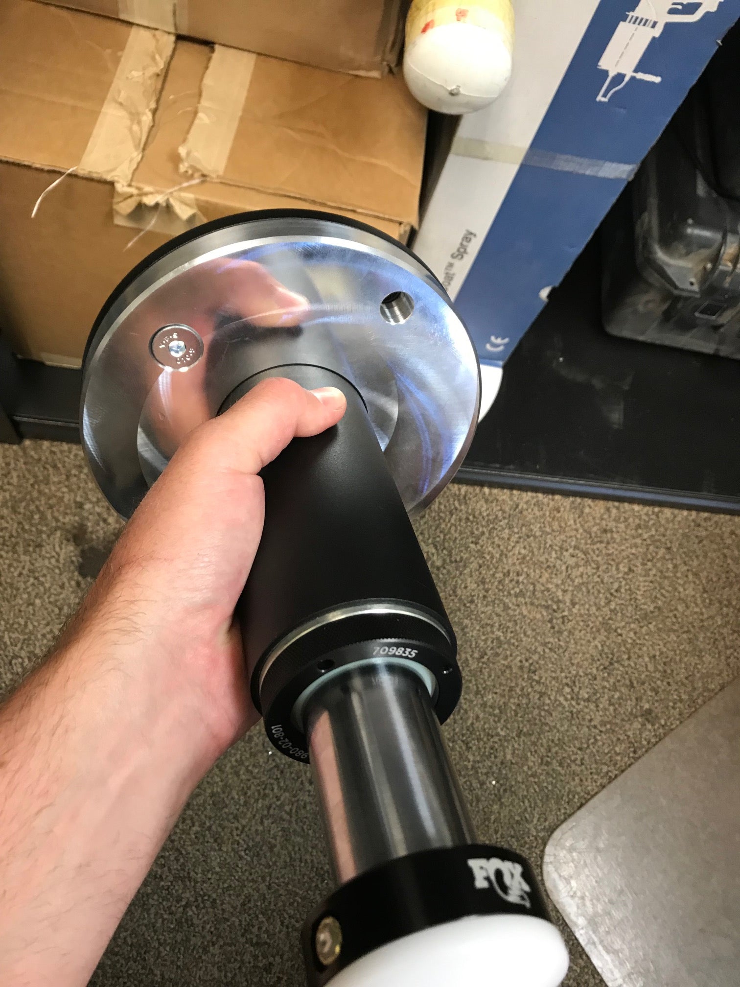 2021 and up Ram TRX rear spring spacer lift kit by Foutz Motorsports held in hand, showcasing its design and materials.