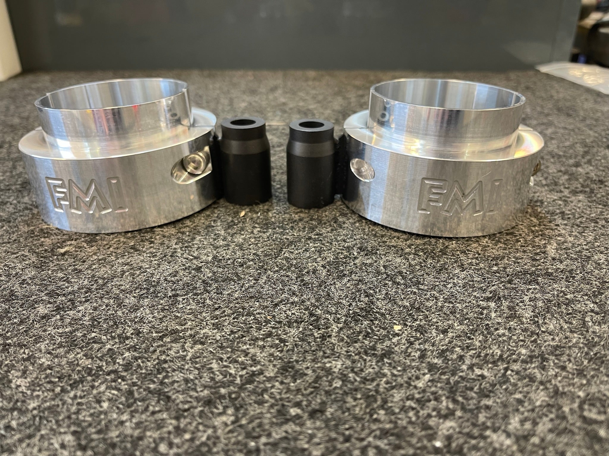 2021-2024 Ram TRX 1.5-inch front leveling kit featuring aluminum spacers and black polyurethane bushings.