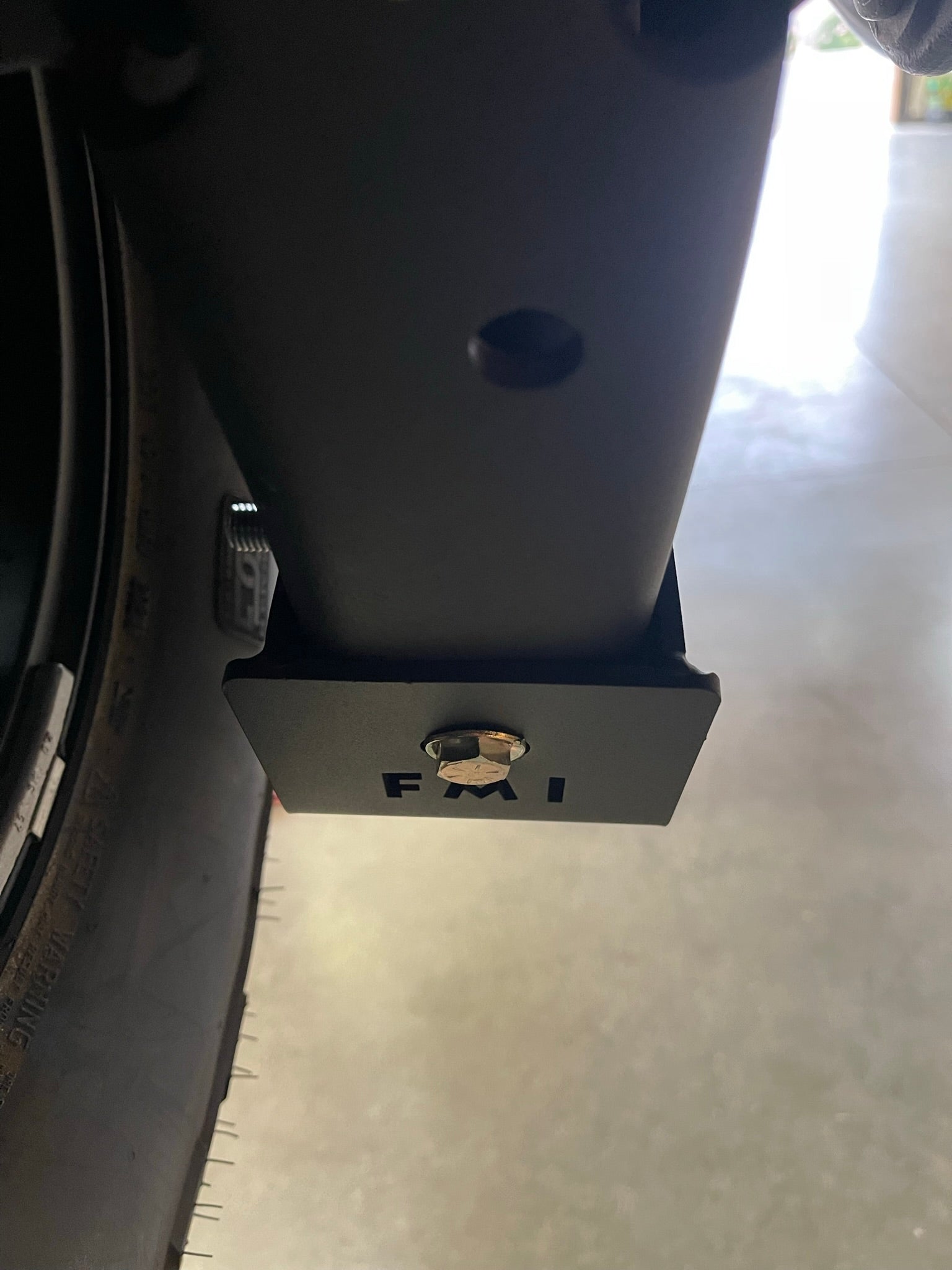 2025 Ram RHO Rear Shock Skid Kit mounted on a vehicle, showcasing durable protection for off-road shocks.