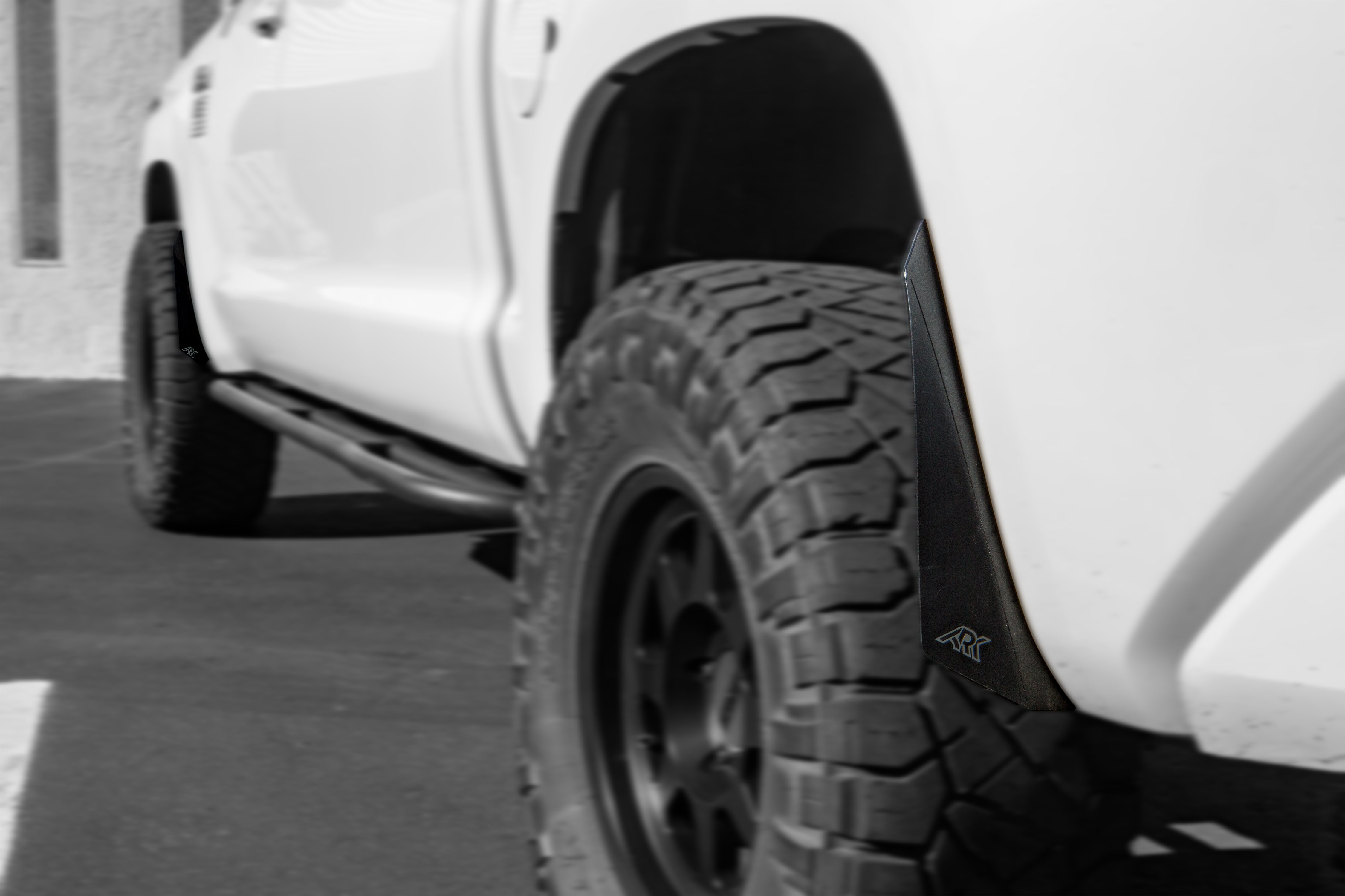 TriXpoly Micro Flares for 2007-2021 Toyota Tundra enhancing tire coverage and style on a lifted truck.