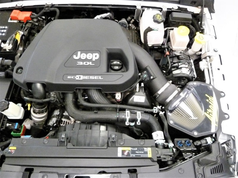 Airaid performance air intake system installed in a 2020-2021 Jeep Wrangler V6 3.0L diesel engine compartment.