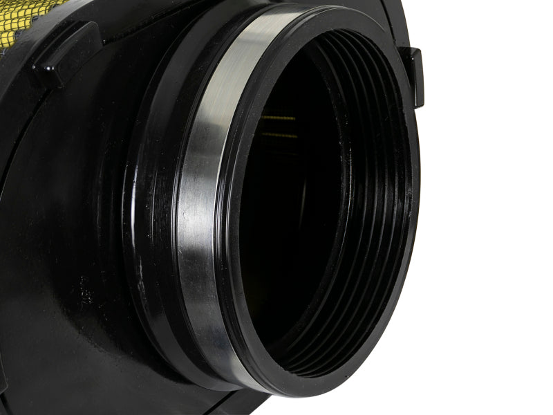 Close-up of the AFE Magnum FORCE replacement air filter showcasing its cylindrical design and threaded opening for secure installation.