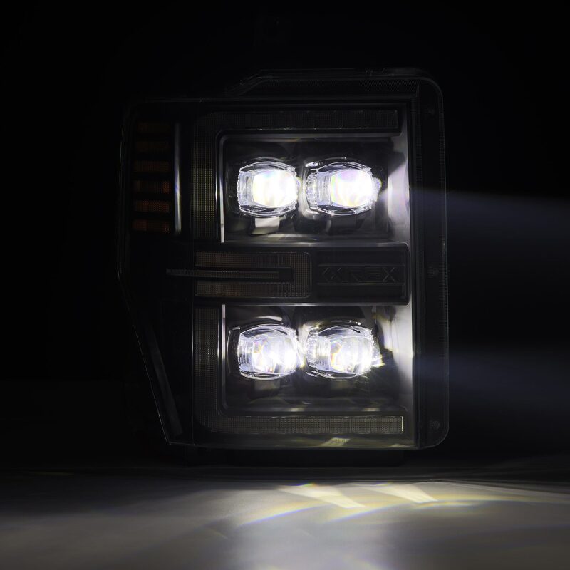 AlphaRex NOVA-Series LED projector headlights for 08-10 Ford F250-550, featuring black housing and sequential signals.