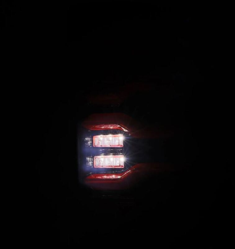 AlphaRex LUXX-Series LED taillights for 09-18 Dodge RAM in black and red with active light feature.