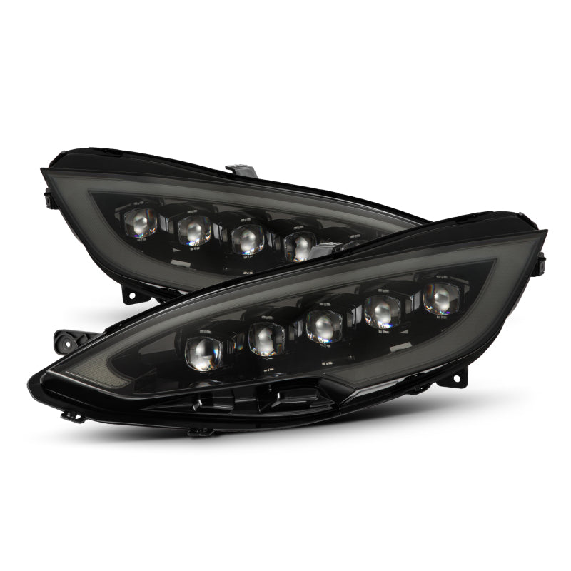 AlphaRex NOVA LED projector headlights for 12-21 Tesla Model S in black with sequential signals and daytime running lights.