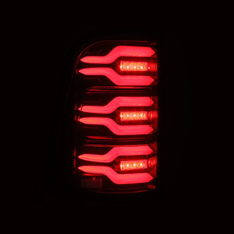 AlphaRex Luxx-Series LED tail lights for 19-21 Dodge Ram 1500 in black and red with sequential signals and active lighting.