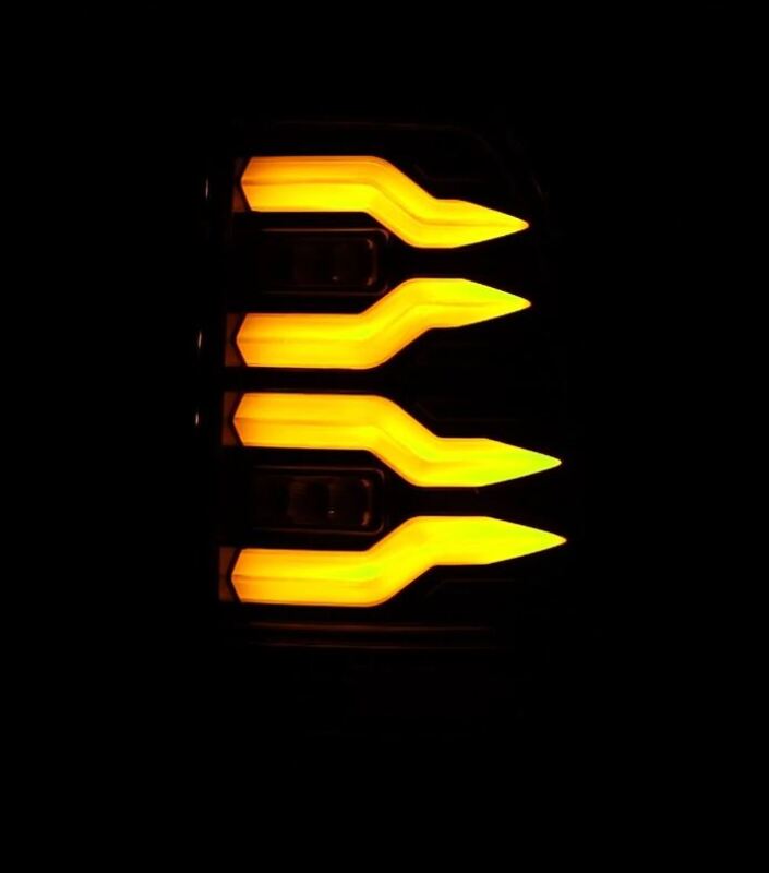 AlphaRex LUXX-Series LED tail lights for 97-03 Ford F150 and 99-16 Ford Super Duty, featuring a sleek black design with bright amber accents.